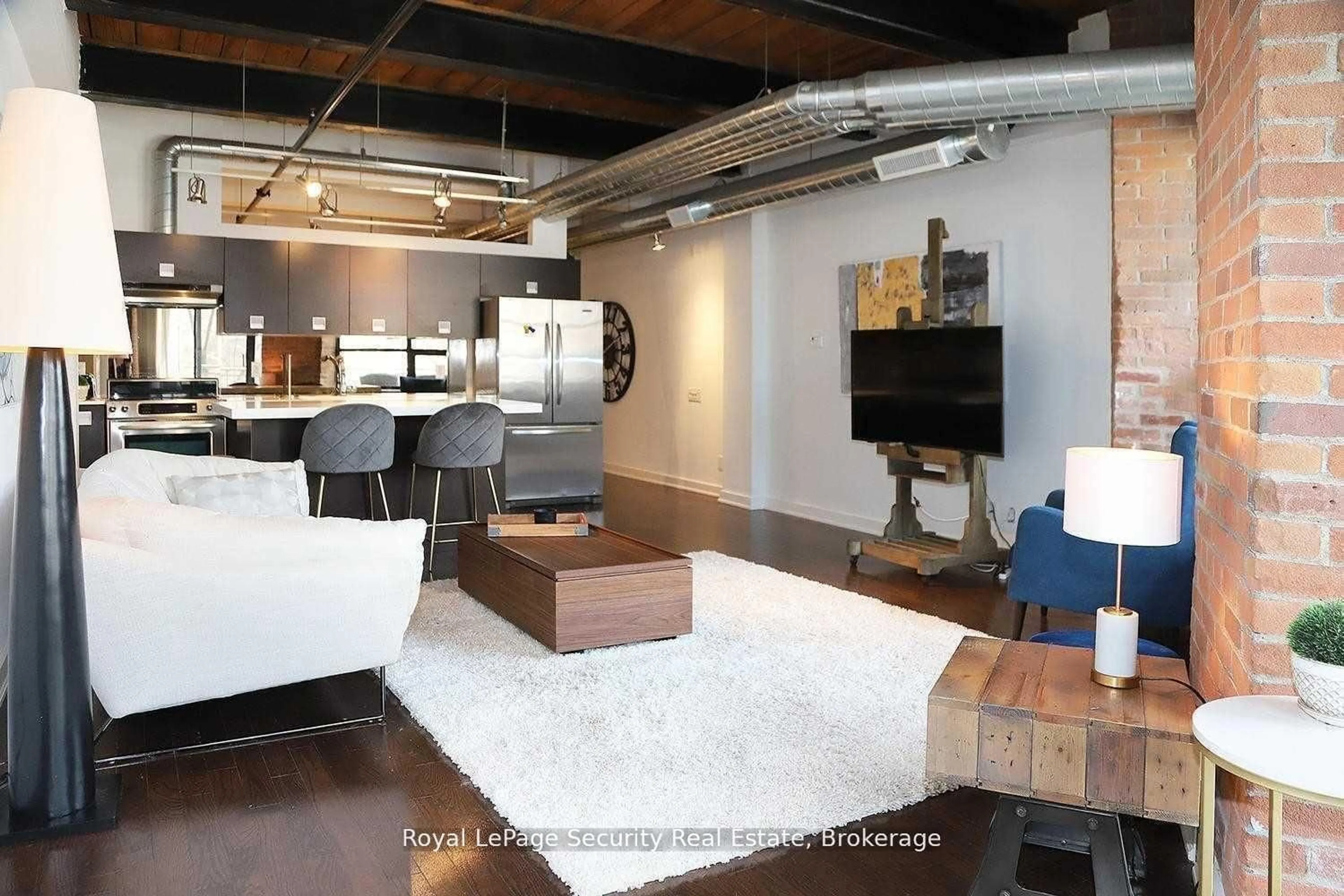 Living room with furniture, unknown for 43 Hanna Ave #208, Toronto Ontario M6K 1X1