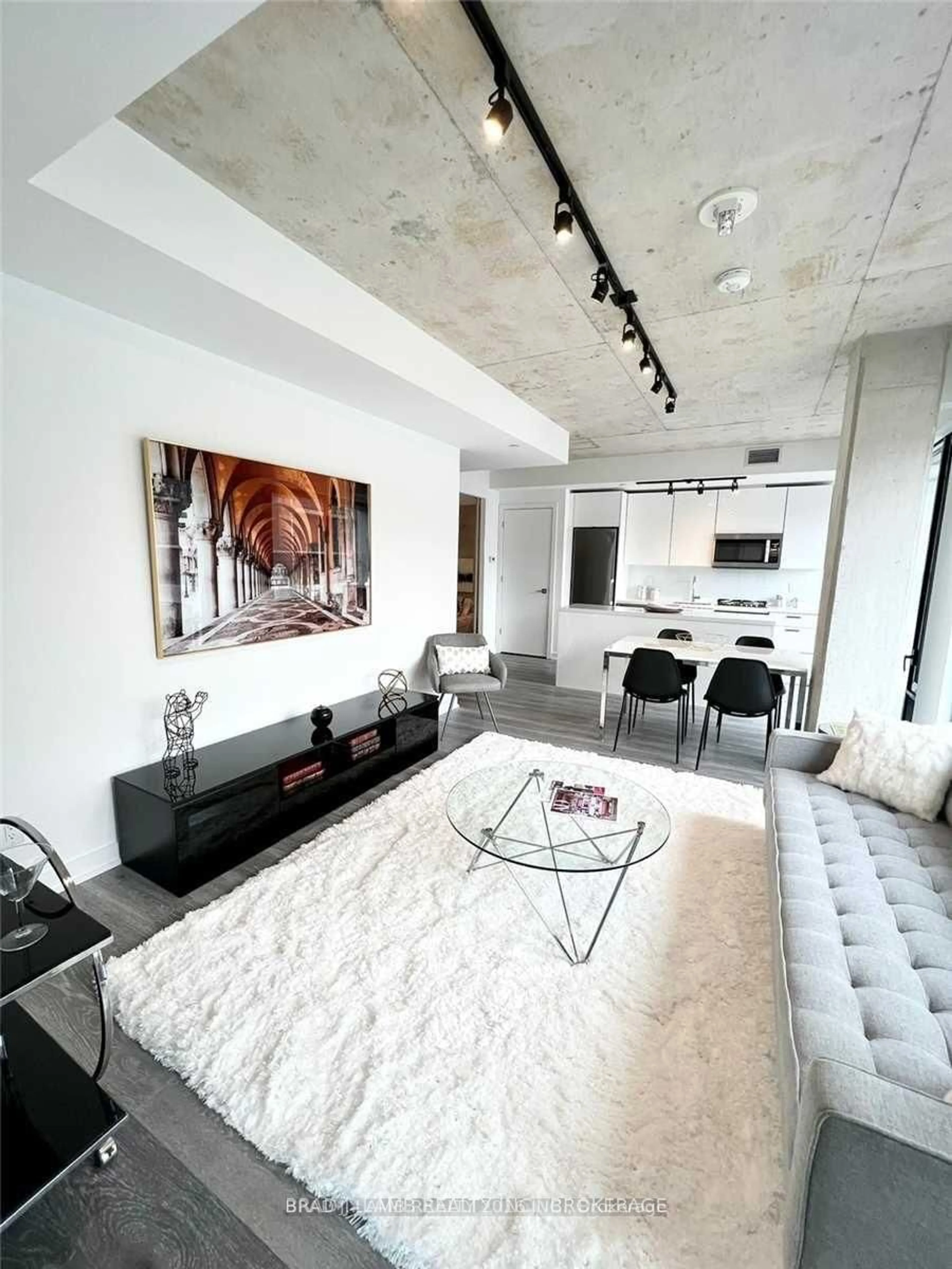 Living room with furniture, cement floor for 55 Ontario St #812, Toronto Ontario M5A 0T8