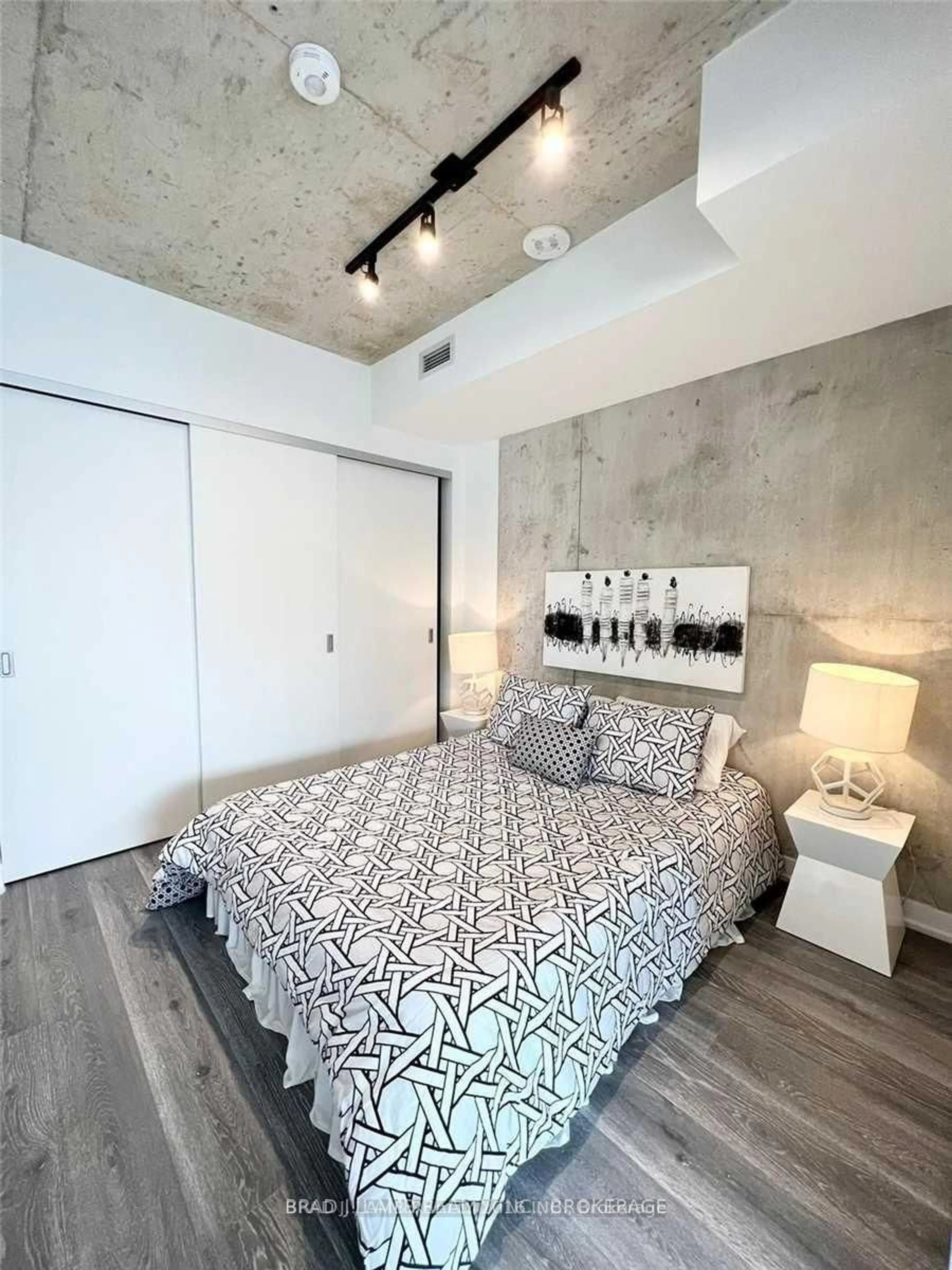 Bedroom with bed, cement floor for 55 Ontario St #812, Toronto Ontario M5A 0T8
