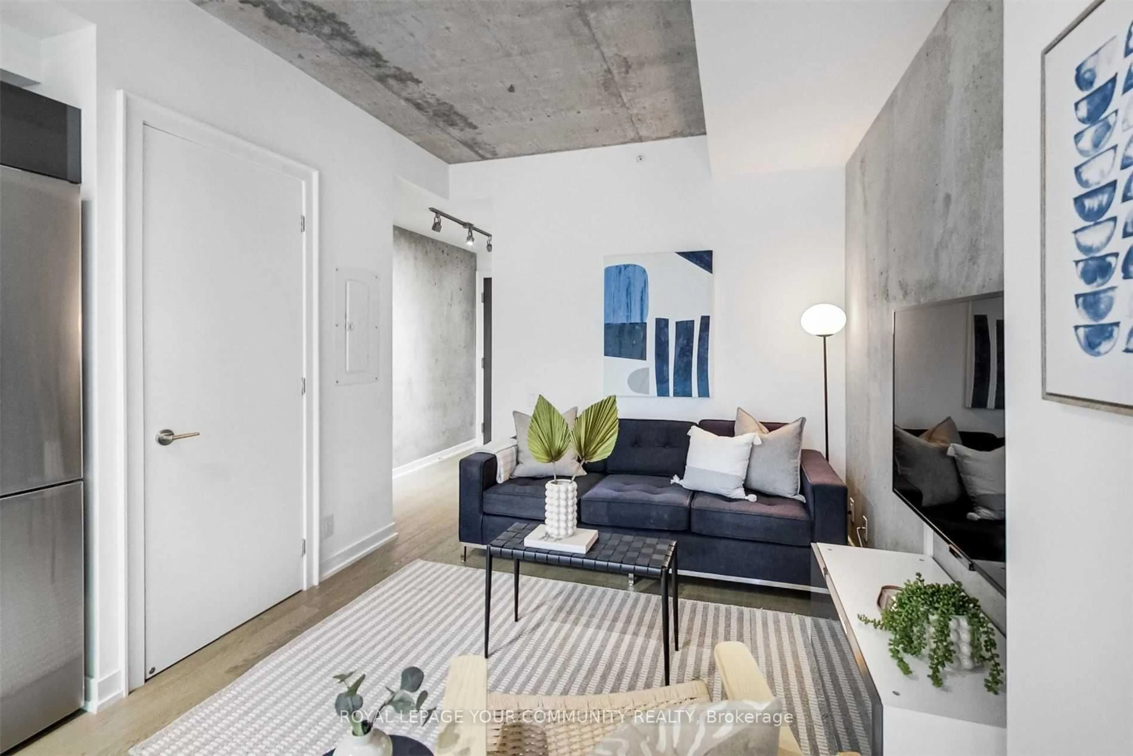 Living room with furniture, cement floor for 11 Charlotte St #403, Toronto Ontario M5V 2H5