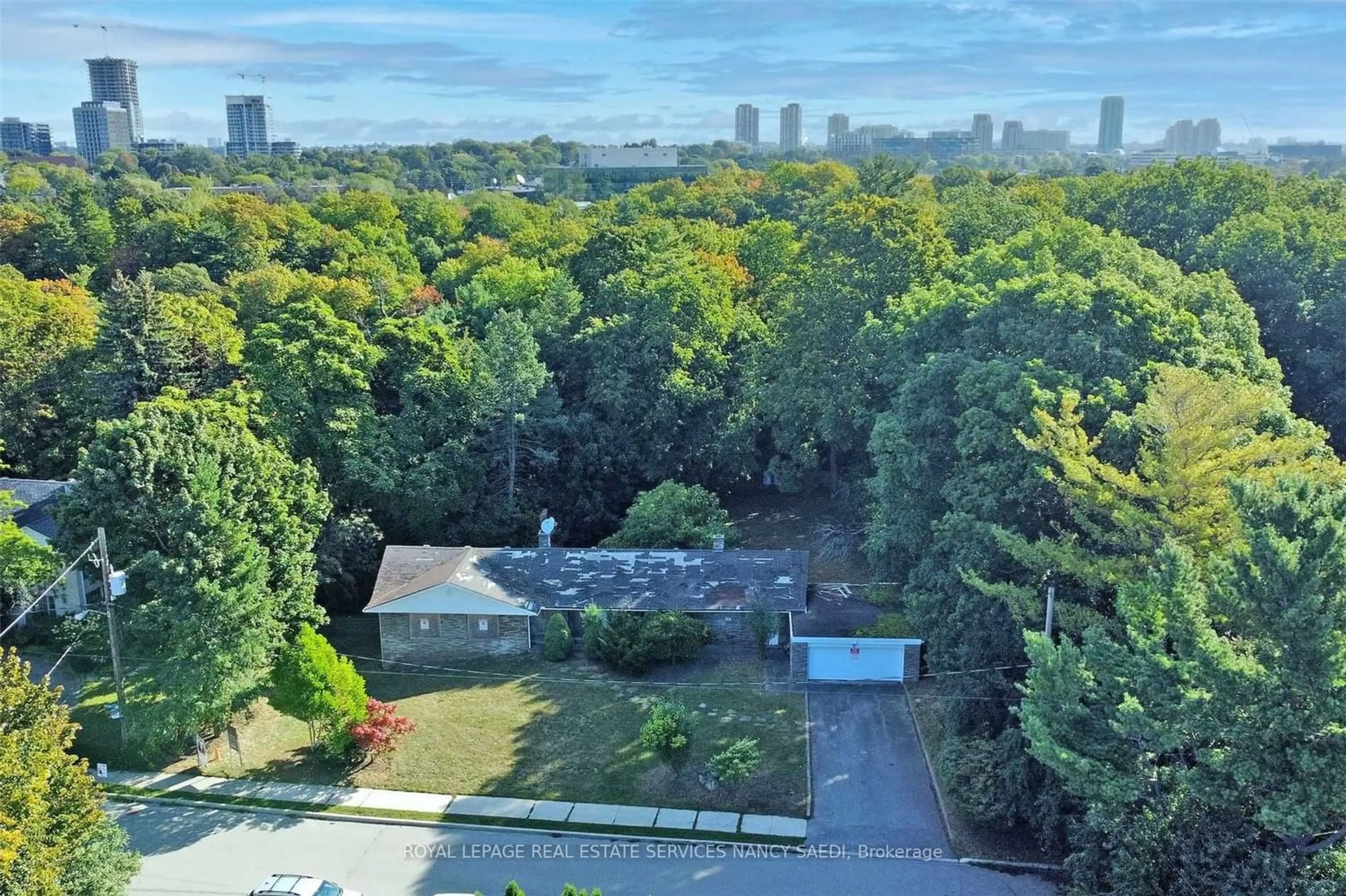 A pic from exterior of the house or condo, the fenced backyard for 38 Salonica Rd, Toronto Ontario M3C 2L9