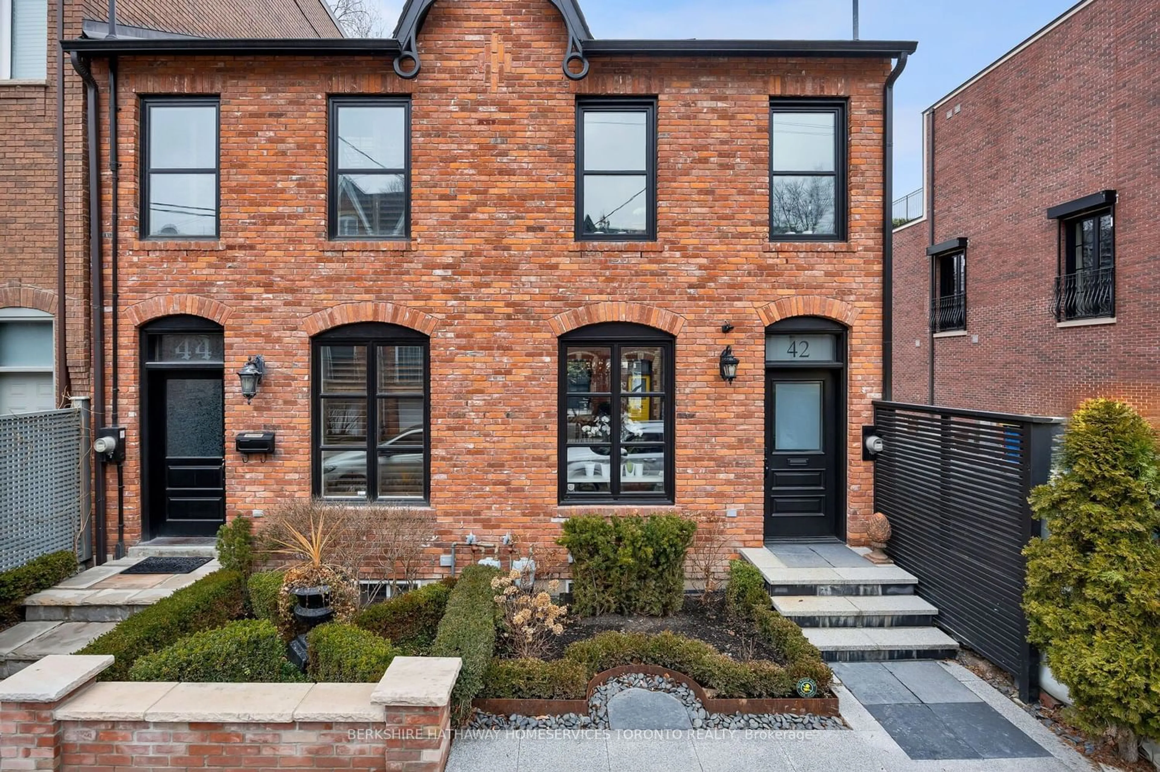 Home with brick exterior material for 42 Berryman St, Toronto Ontario M5R 1M6