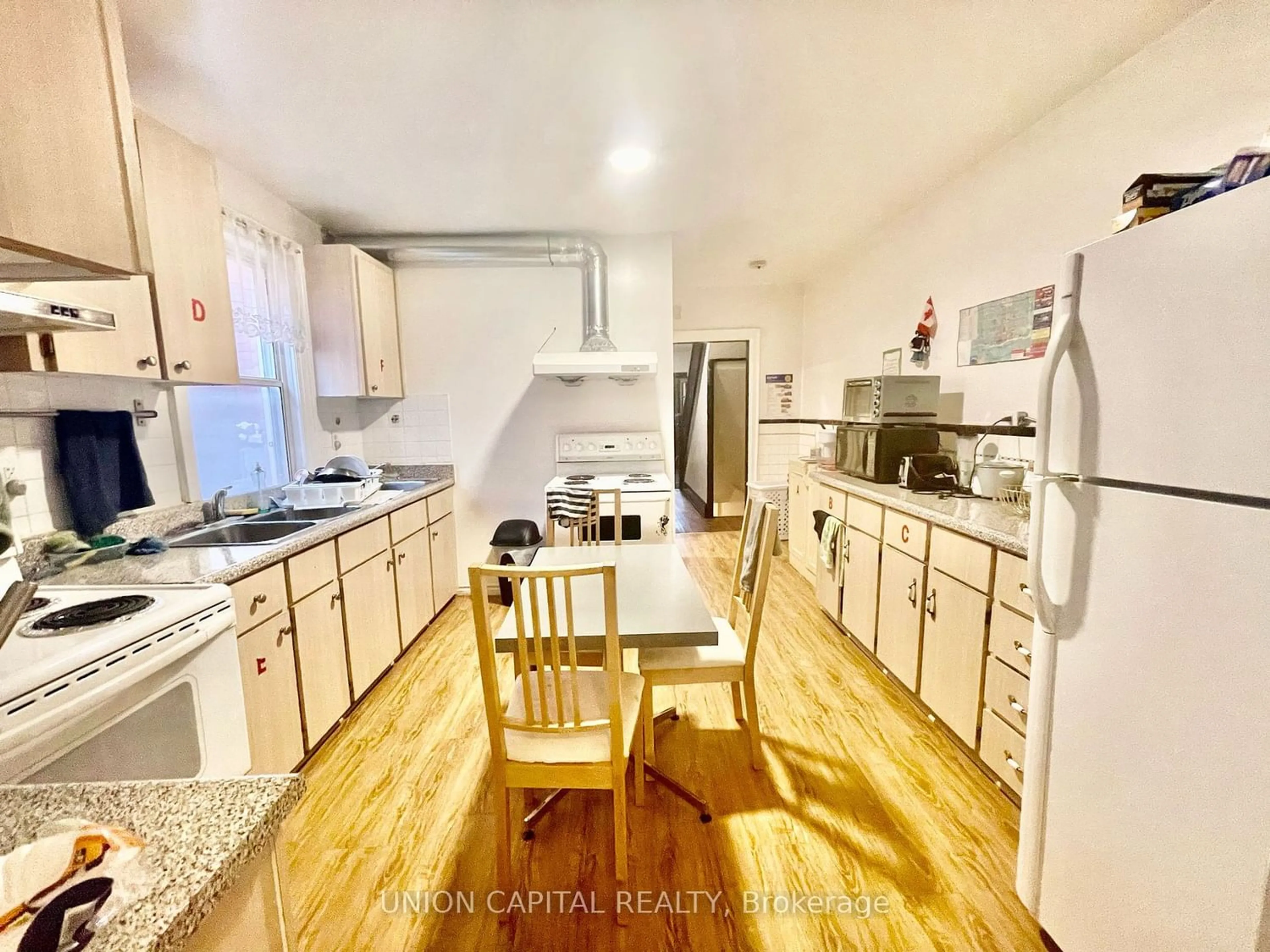 Kitchen with laundary machines for 69 Denison Ave, Toronto Ontario M5T 2M7
