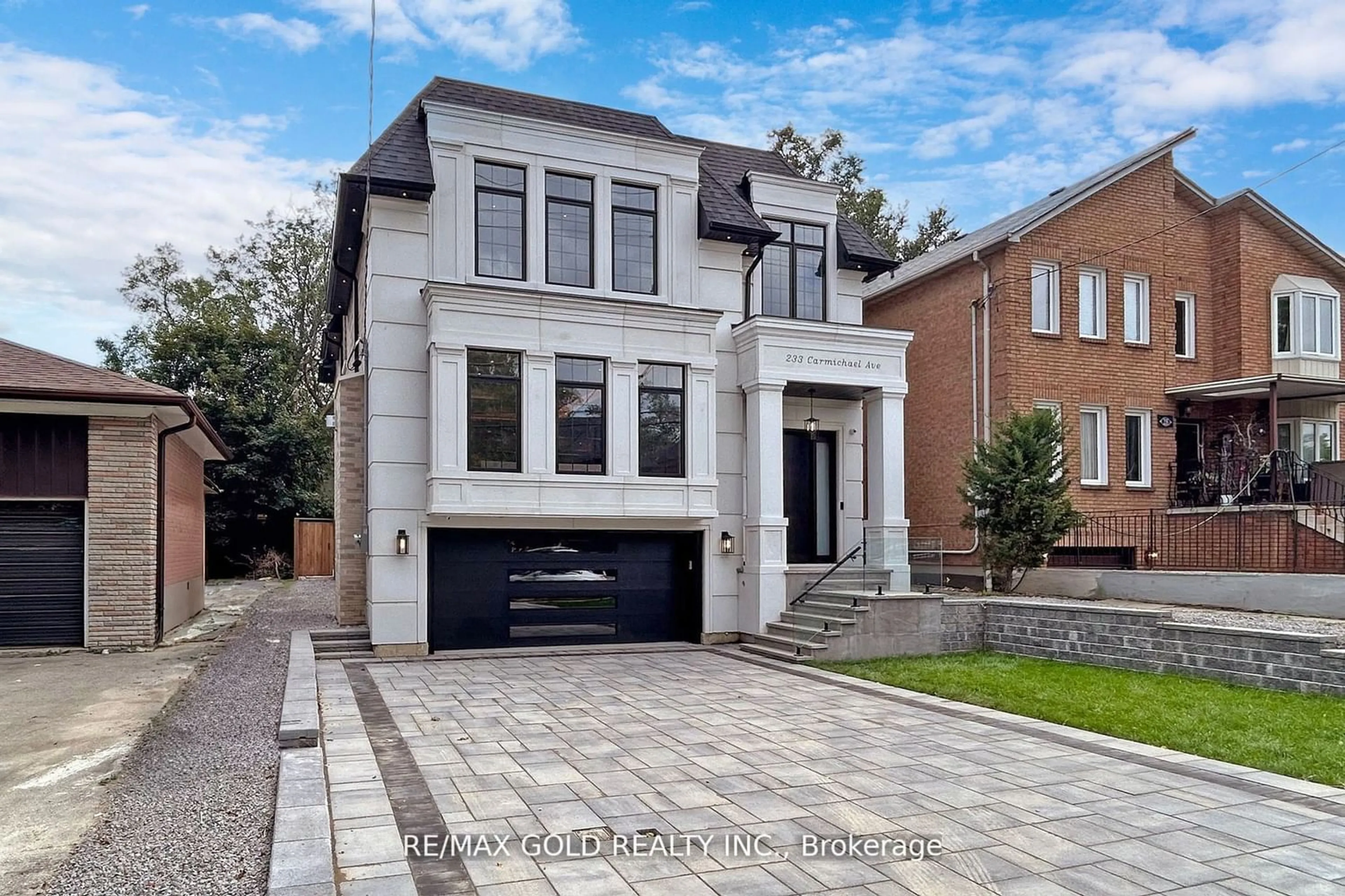 Home with brick exterior material for 233 Carmichael Ave, Toronto Ontario M5M 2X5