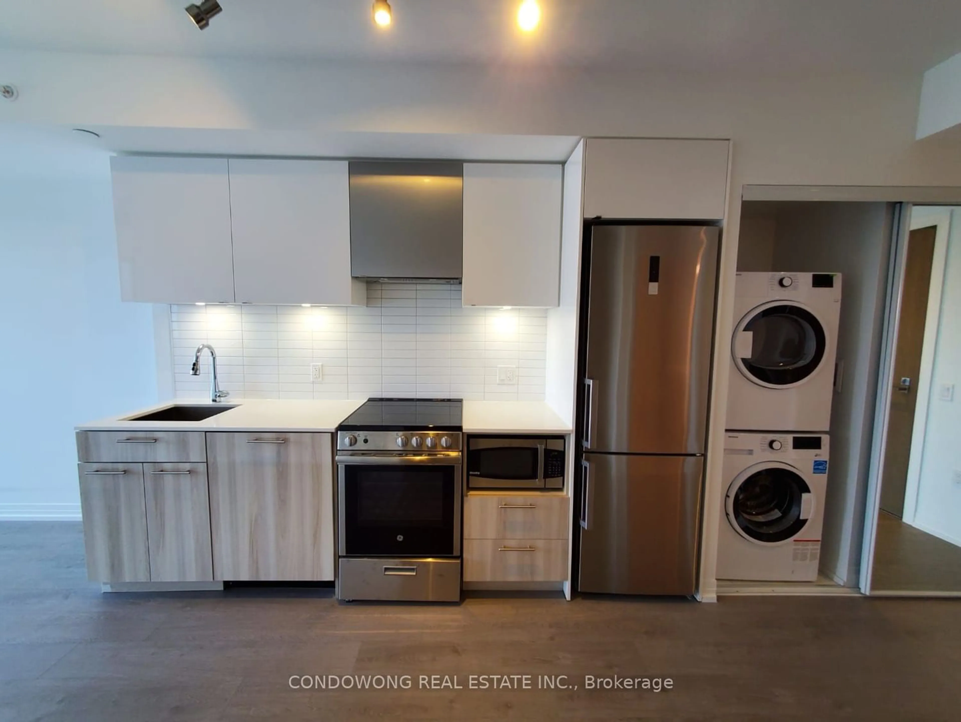 Kitchen with laundary machines for 251 Jarvis St #3006, Toronto Ontario M5B 0C3