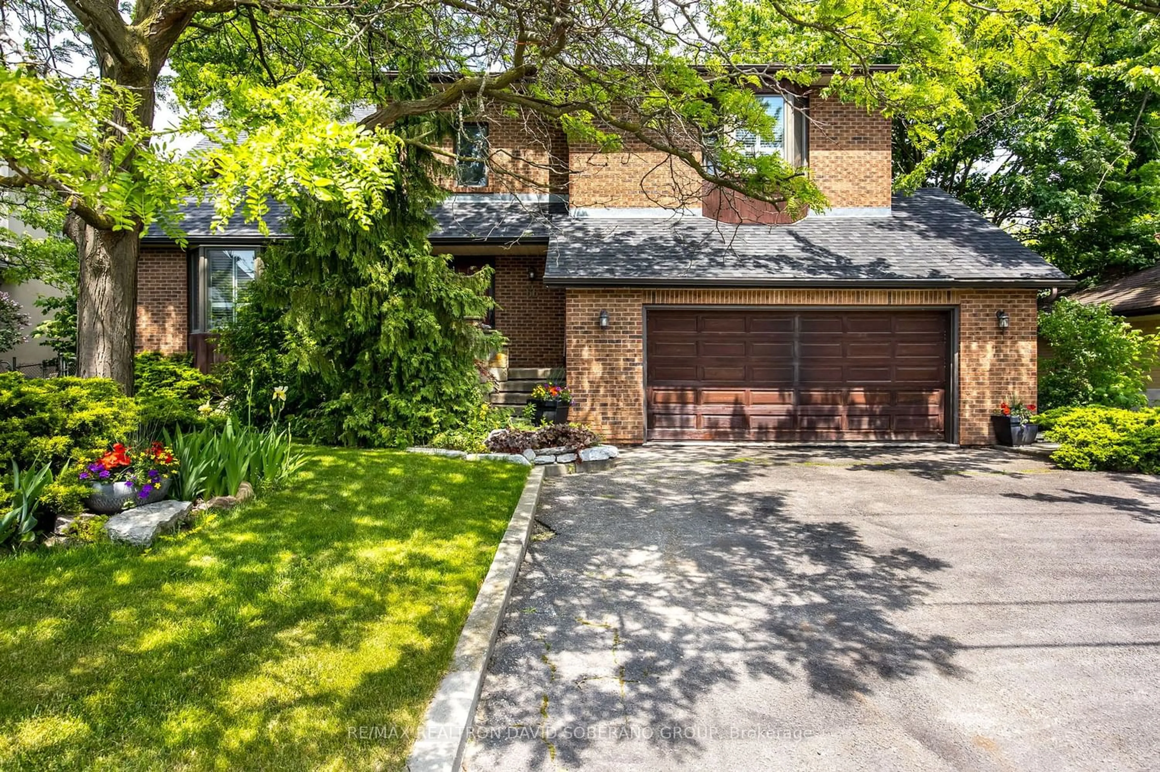 Home with brick exterior material for 66 Reiner Rd, Toronto Ontario M3H 2L5