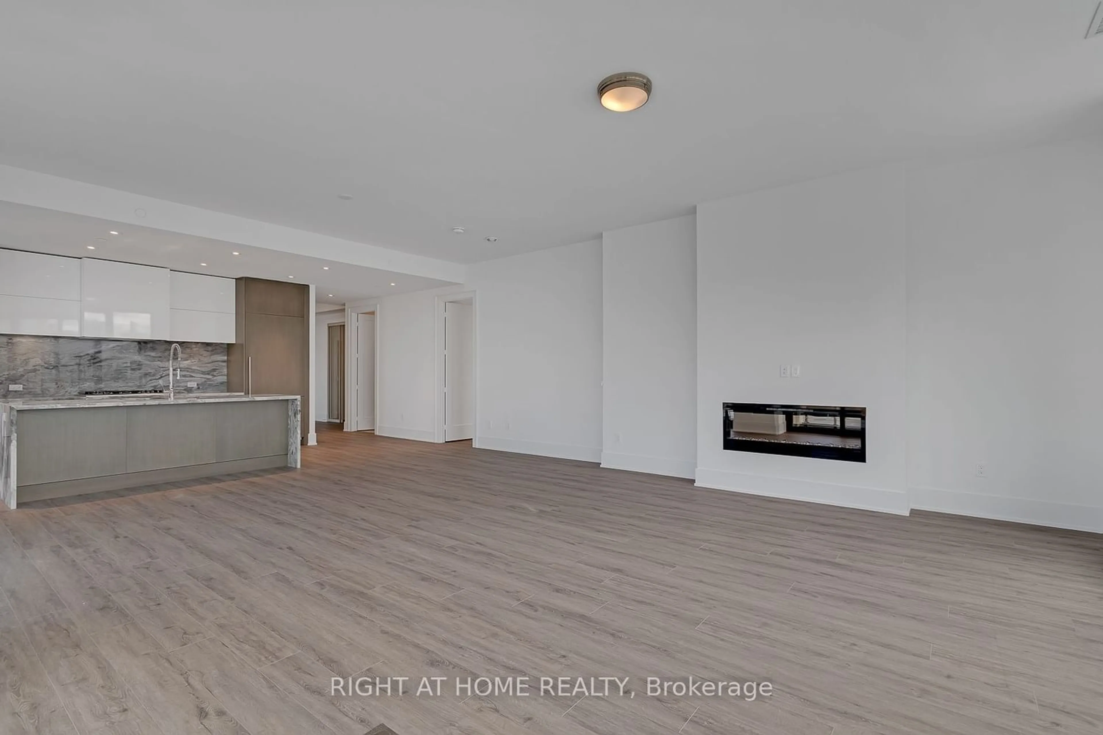 A pic of a room, wood floors for 118 Merchants' Wharf #912, Toronto Ontario M5A 0L3