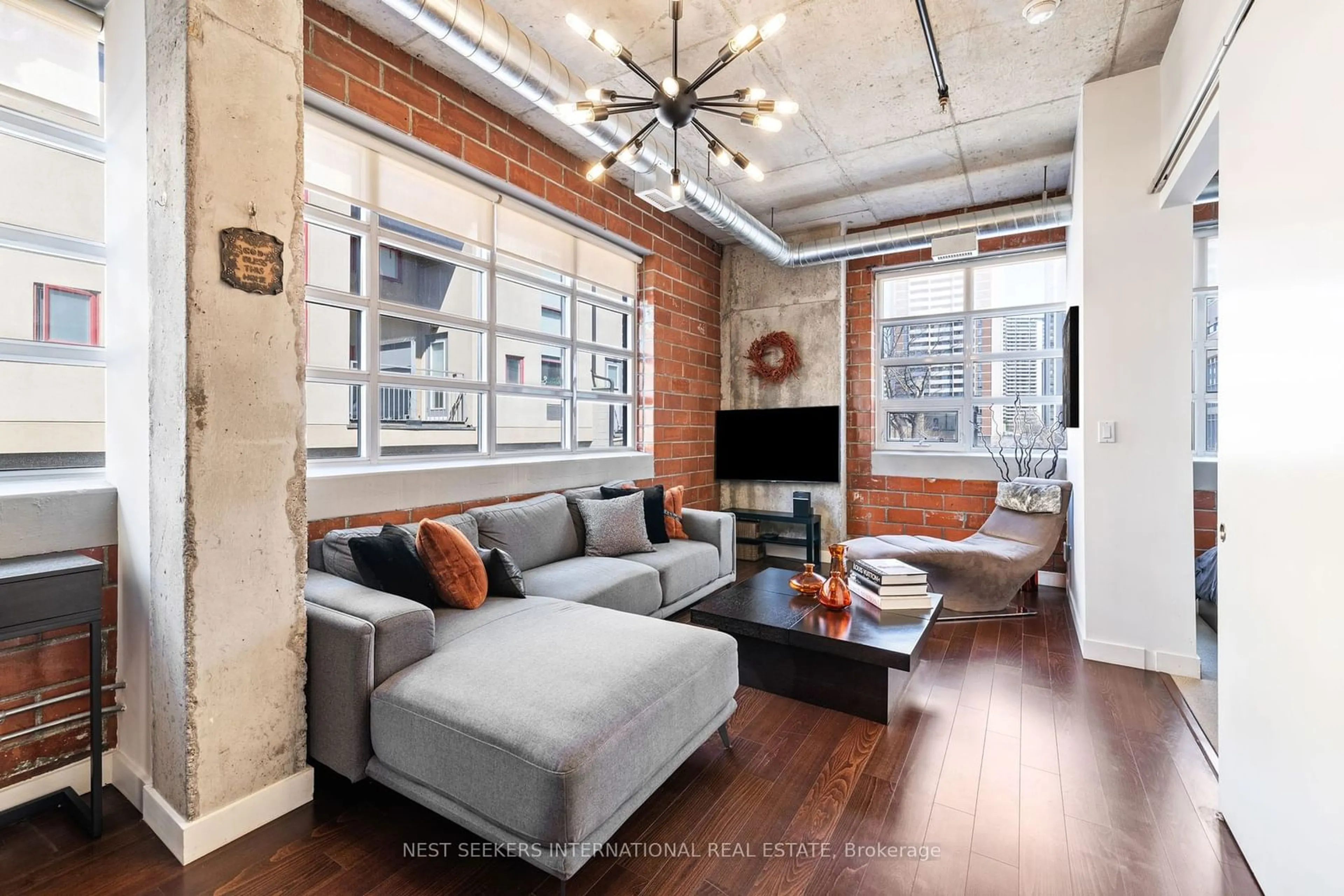 Living room for 10 Wellesley Pl #302, Toronto Ontario M4Y 1B1