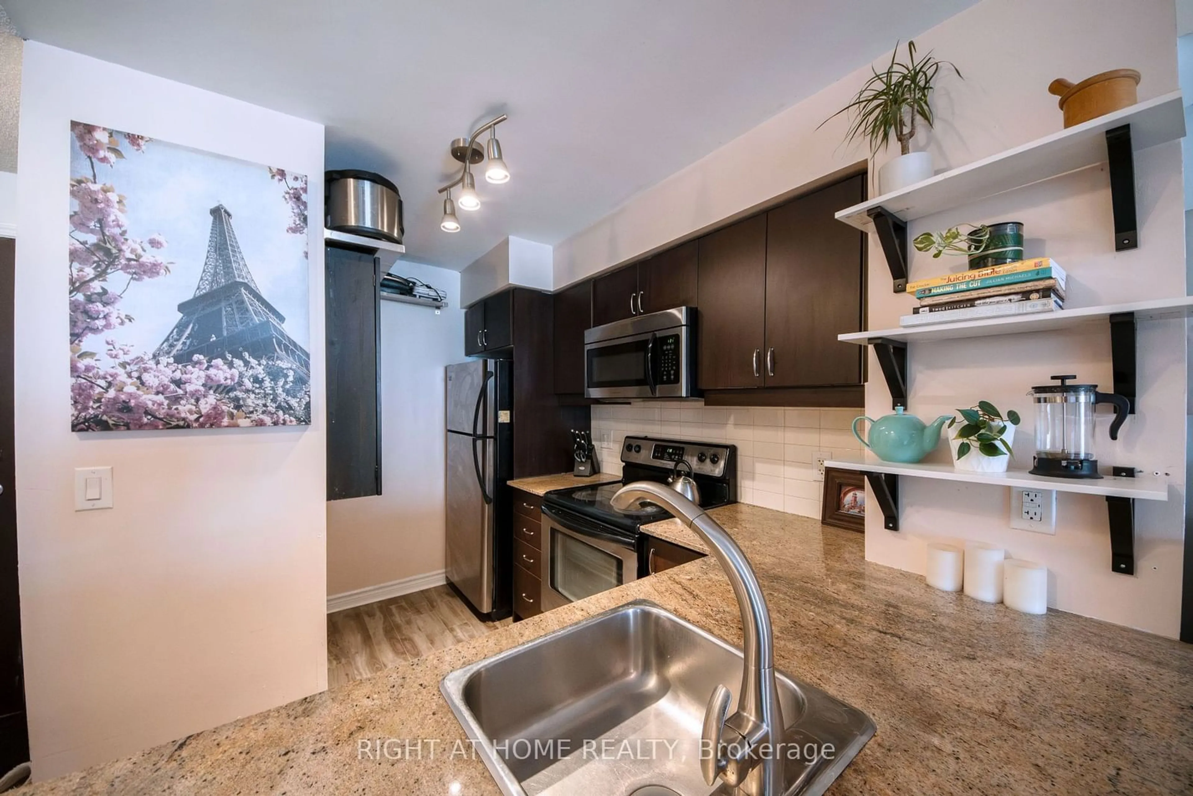Kitchen with laundary machines for 27 Rean Dr #215, Toronto Ontario M2K 0A6