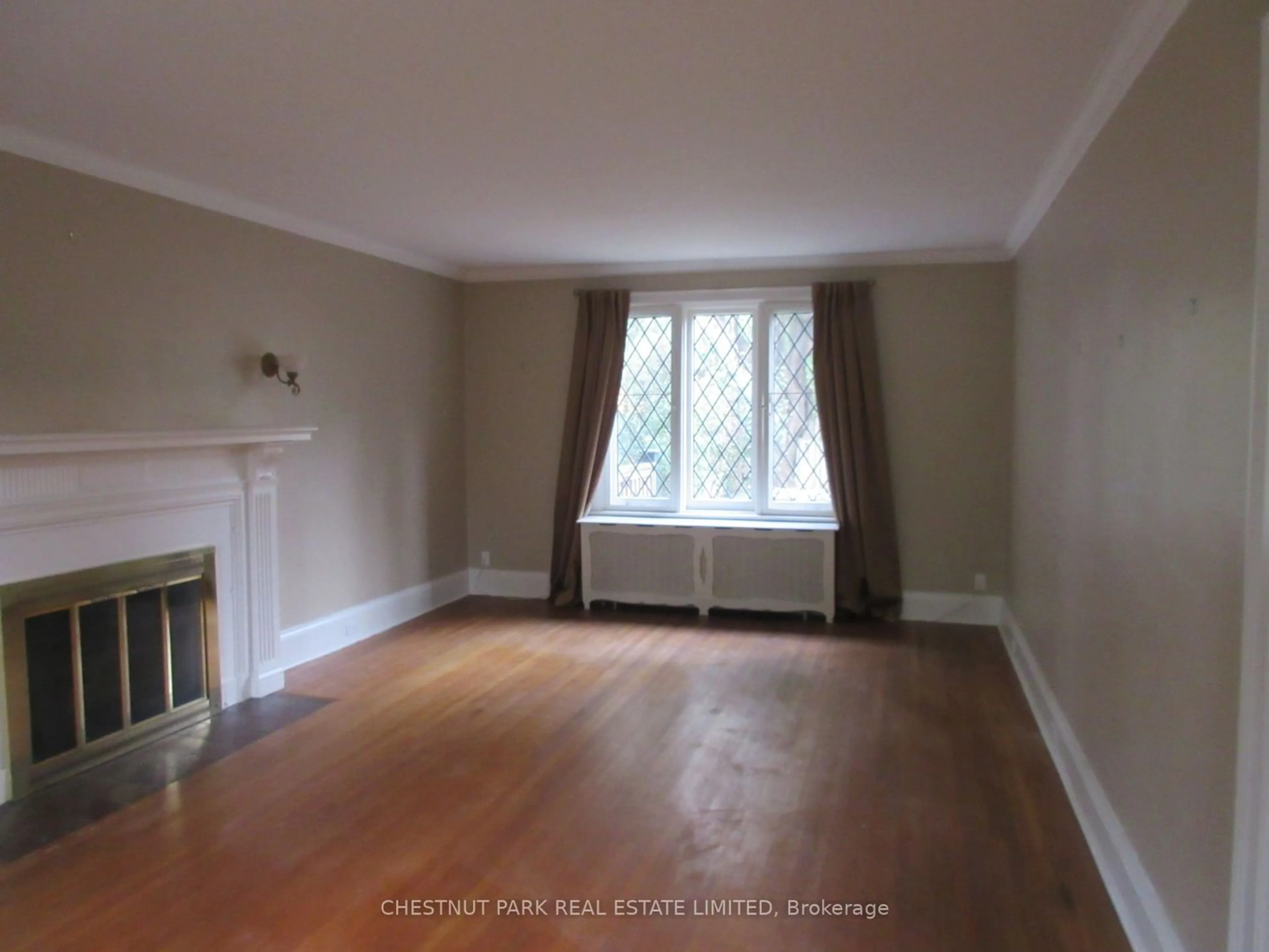 A pic of a room, wood floors for 46 Elderwood Dr, Toronto Ontario M5P 1X1