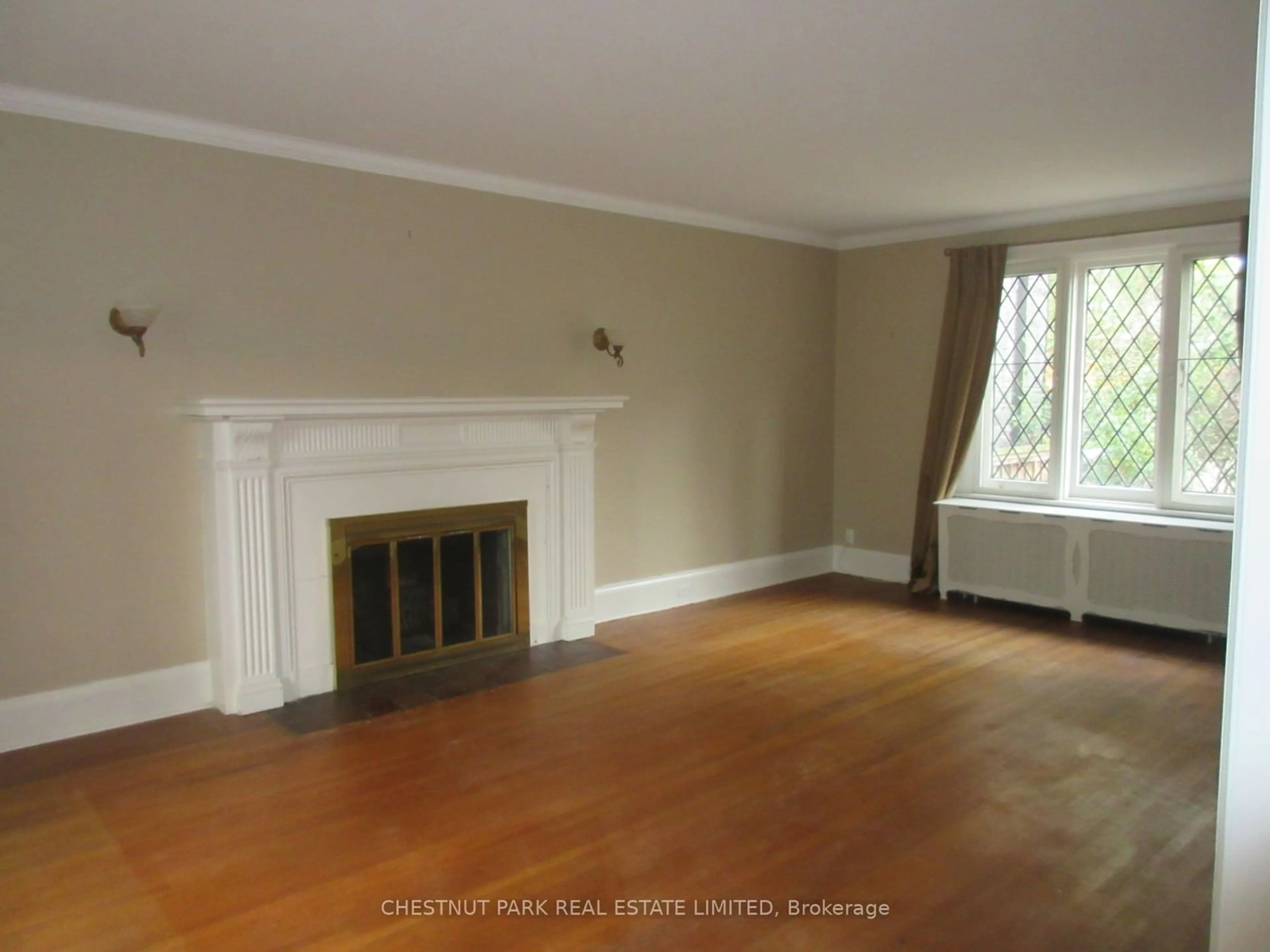 A pic of a room, wood floors for 46 Elderwood Dr, Toronto Ontario M5P 1X1