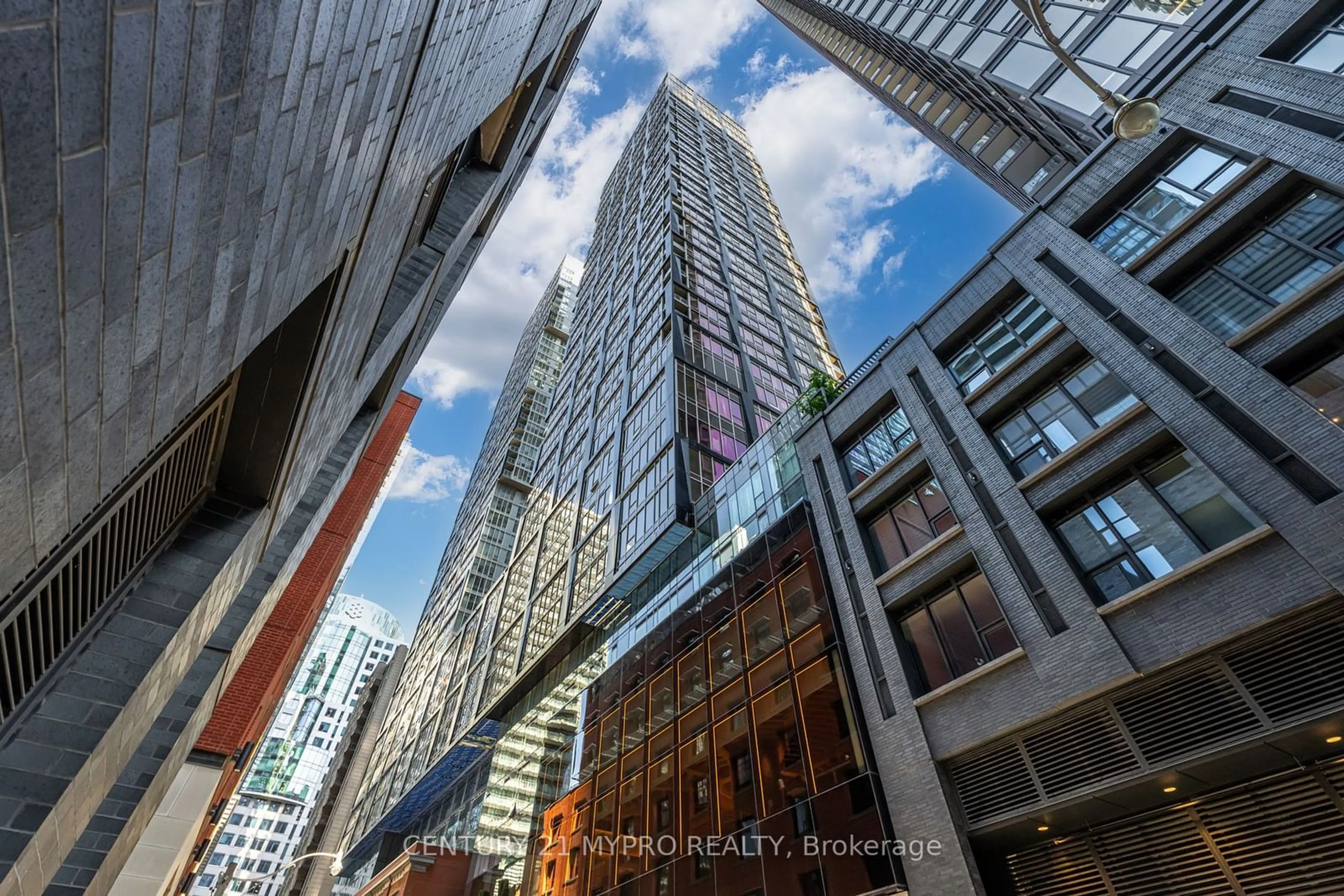 A pic from exterior of the house or condo, the view of city buildings for 35 Mercer St #2013, Toronto Ontario M5V 0V1