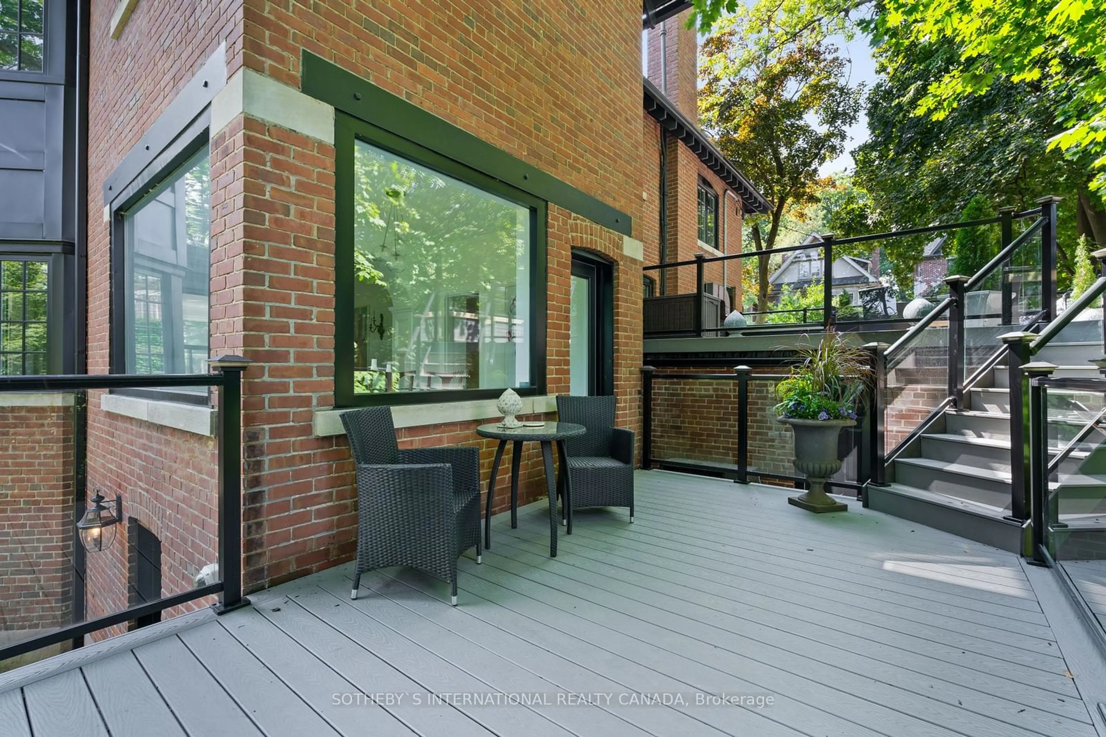 Patio, the fenced backyard for 379 Walmer Rd, Toronto Ontario M5R 2Y5