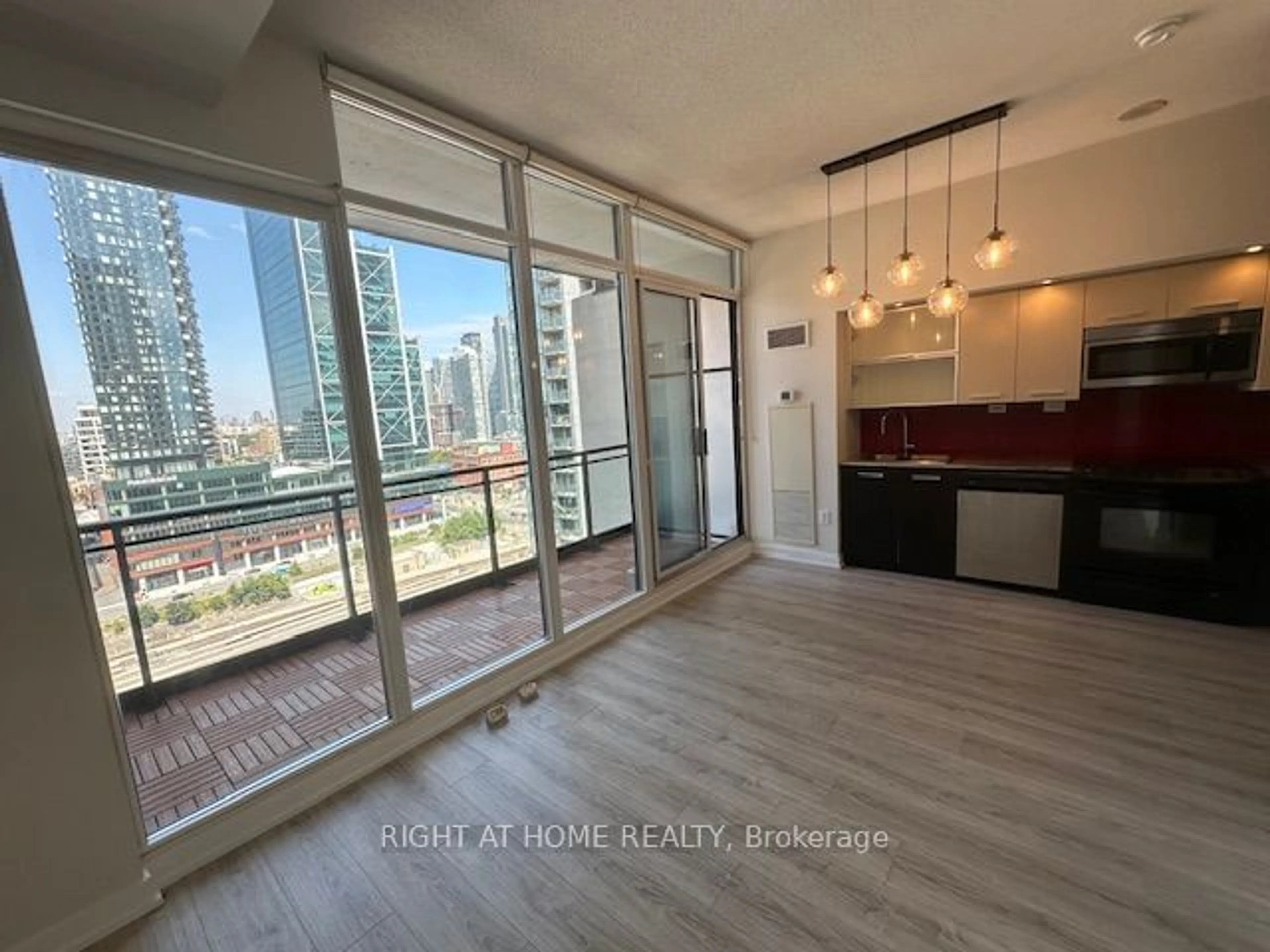 A pic of a room, wood floors for 8 Telegram Mews #1908, Toronto Ontario M5V 3Z5