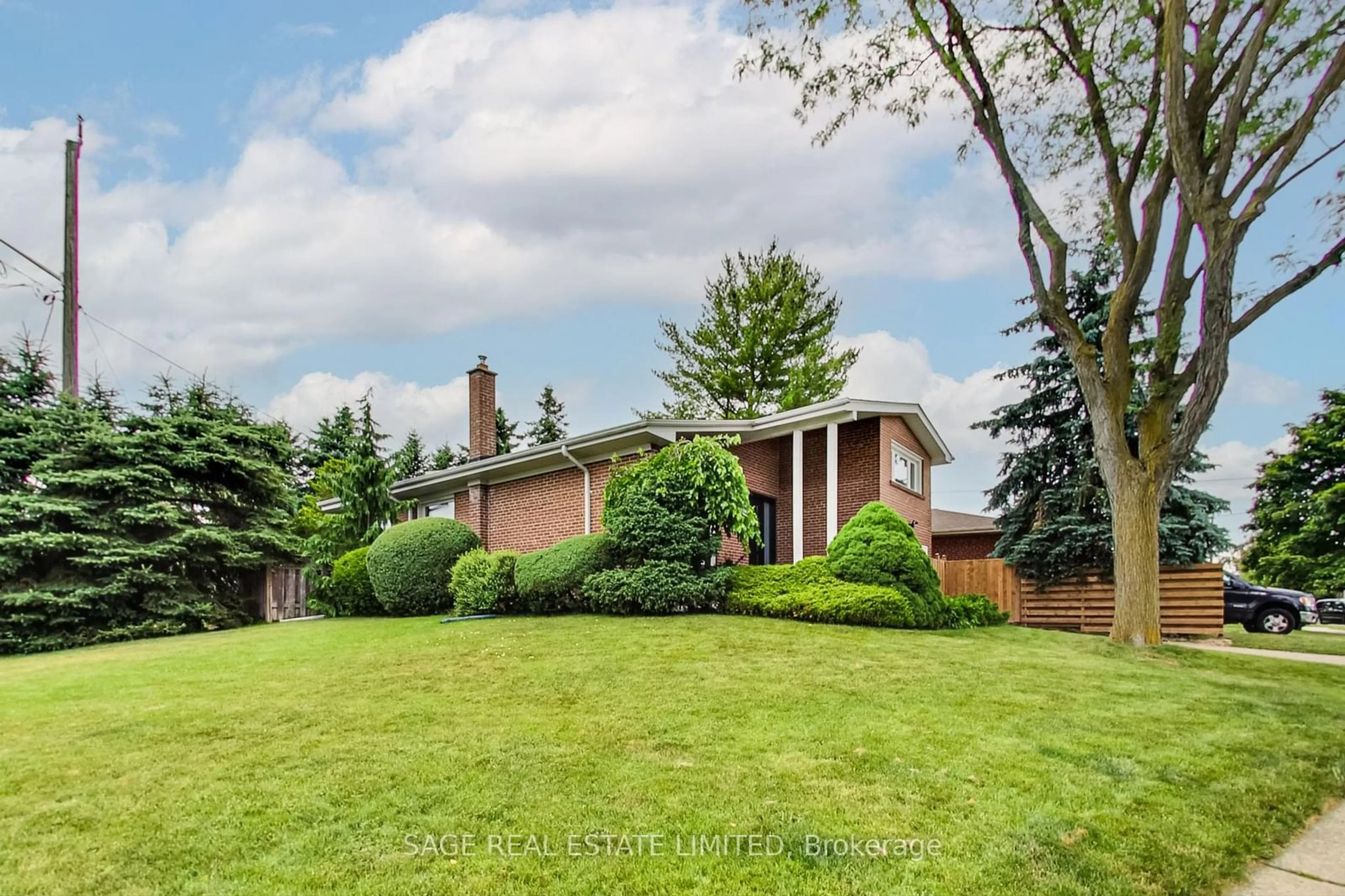 Frontside or backside of a home, the fenced backyard for 164 Sweeney Dr, Toronto Ontario M4A 1V2