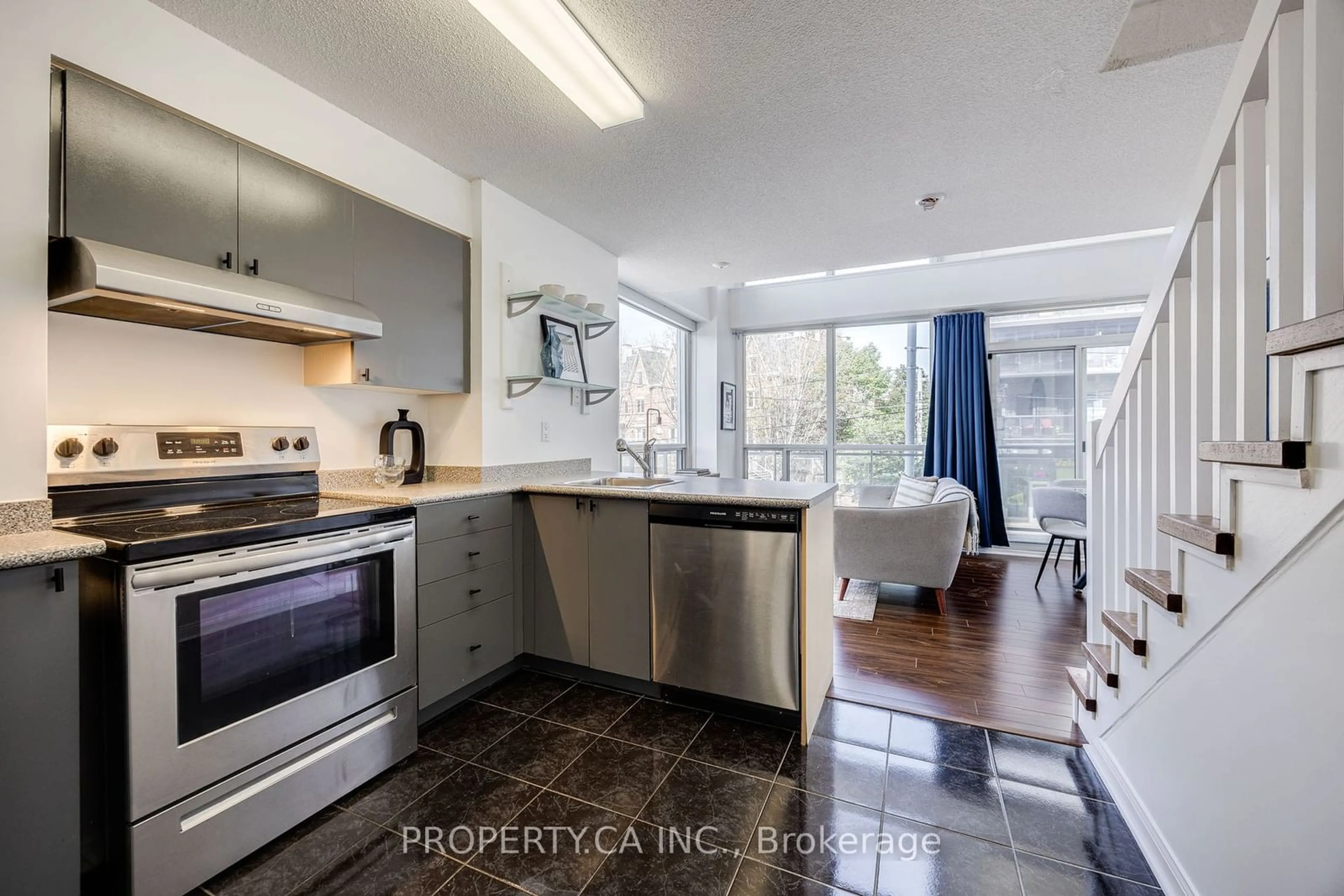 Kitchen with laundary machines for 1029 King St #208, Toronto Ontario M6K 3M9