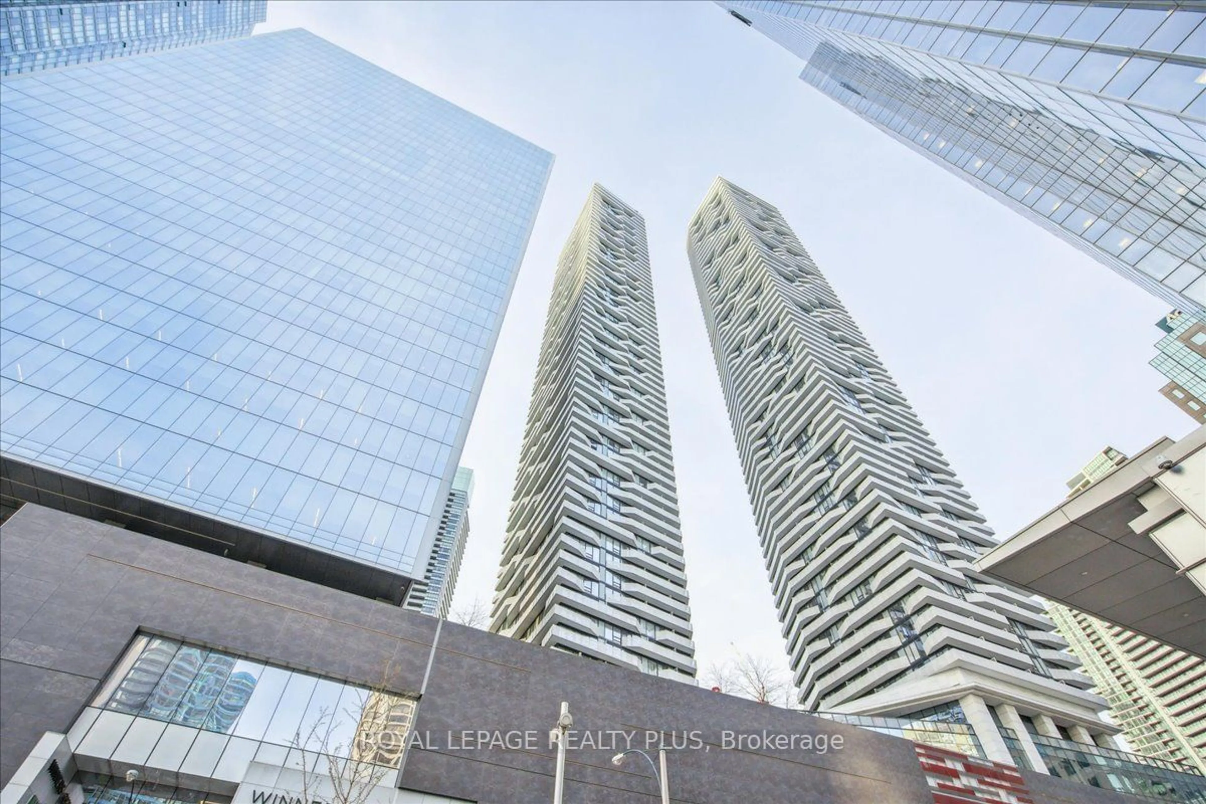 A pic from exterior of the house or condo, the view of city buildings for 100 Harbour St #1010, Toronto Ontario M5J 0B5