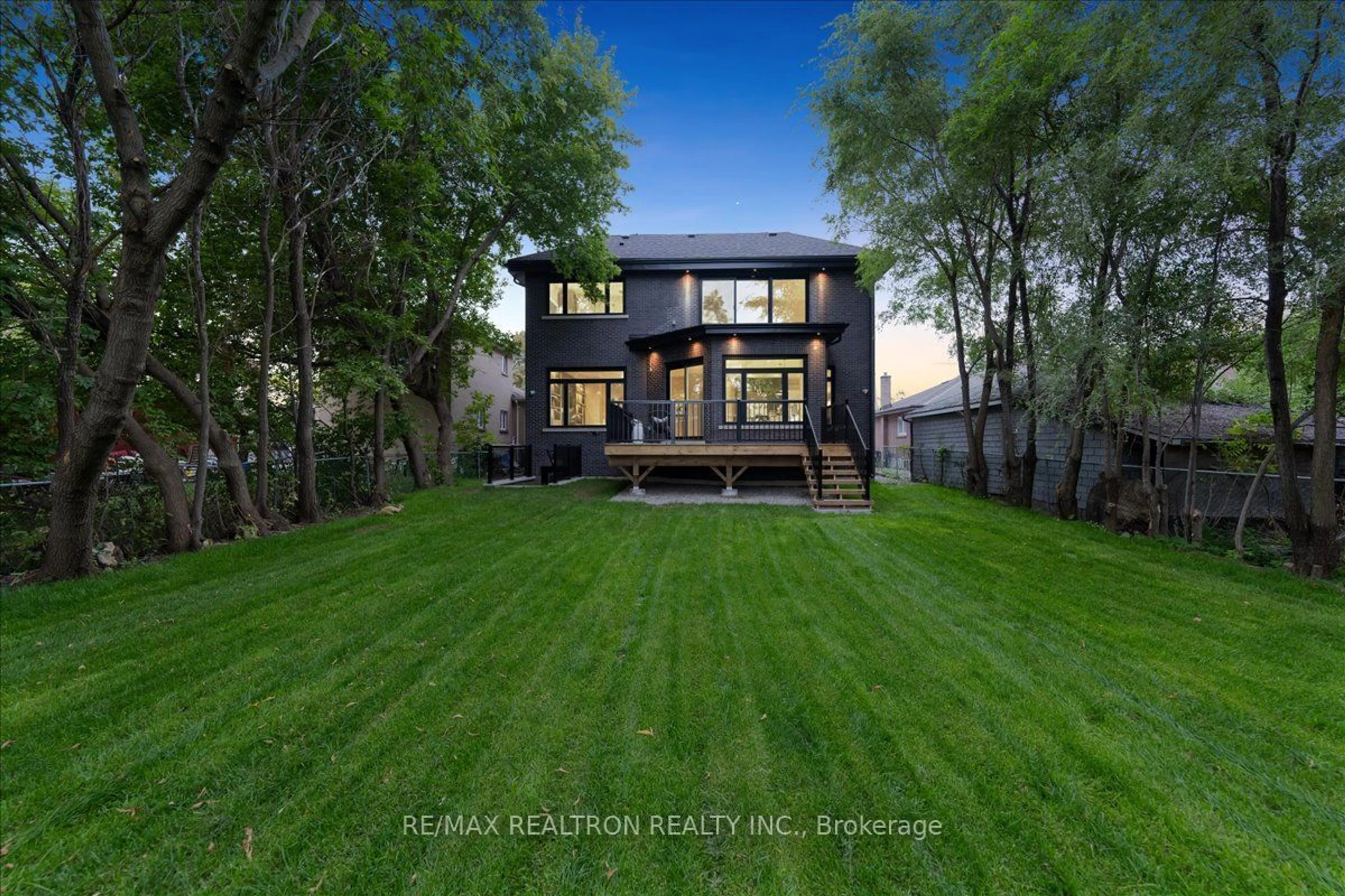 Frontside or backside of a home, the fenced backyard for 275 Reiner Rd, Toronto Ontario M3H 2M5