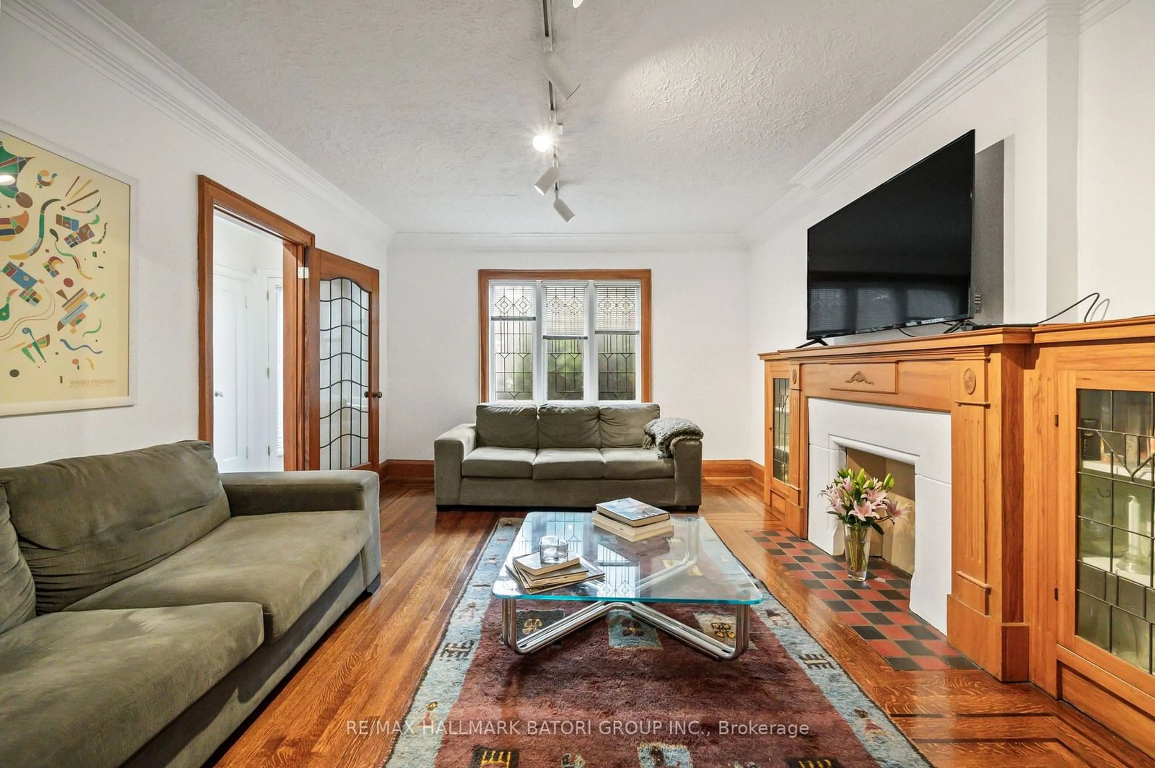 Living room, wood floors for 242 Castlefield Ave, Toronto Ontario M4R 1G7