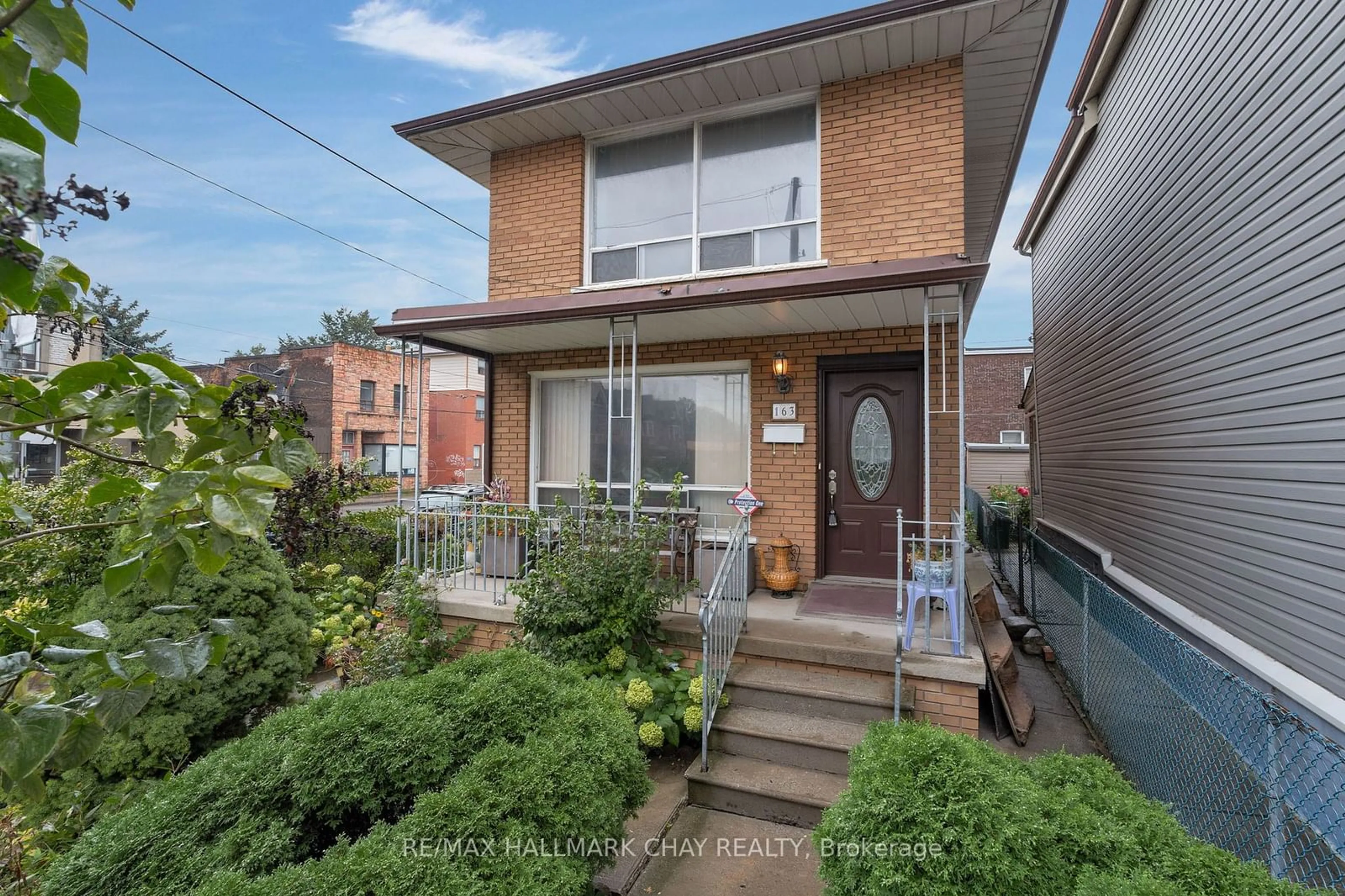 Frontside or backside of a home, the street view for 163 Saint Clarens Ave, Toronto Ontario M6K 2S9