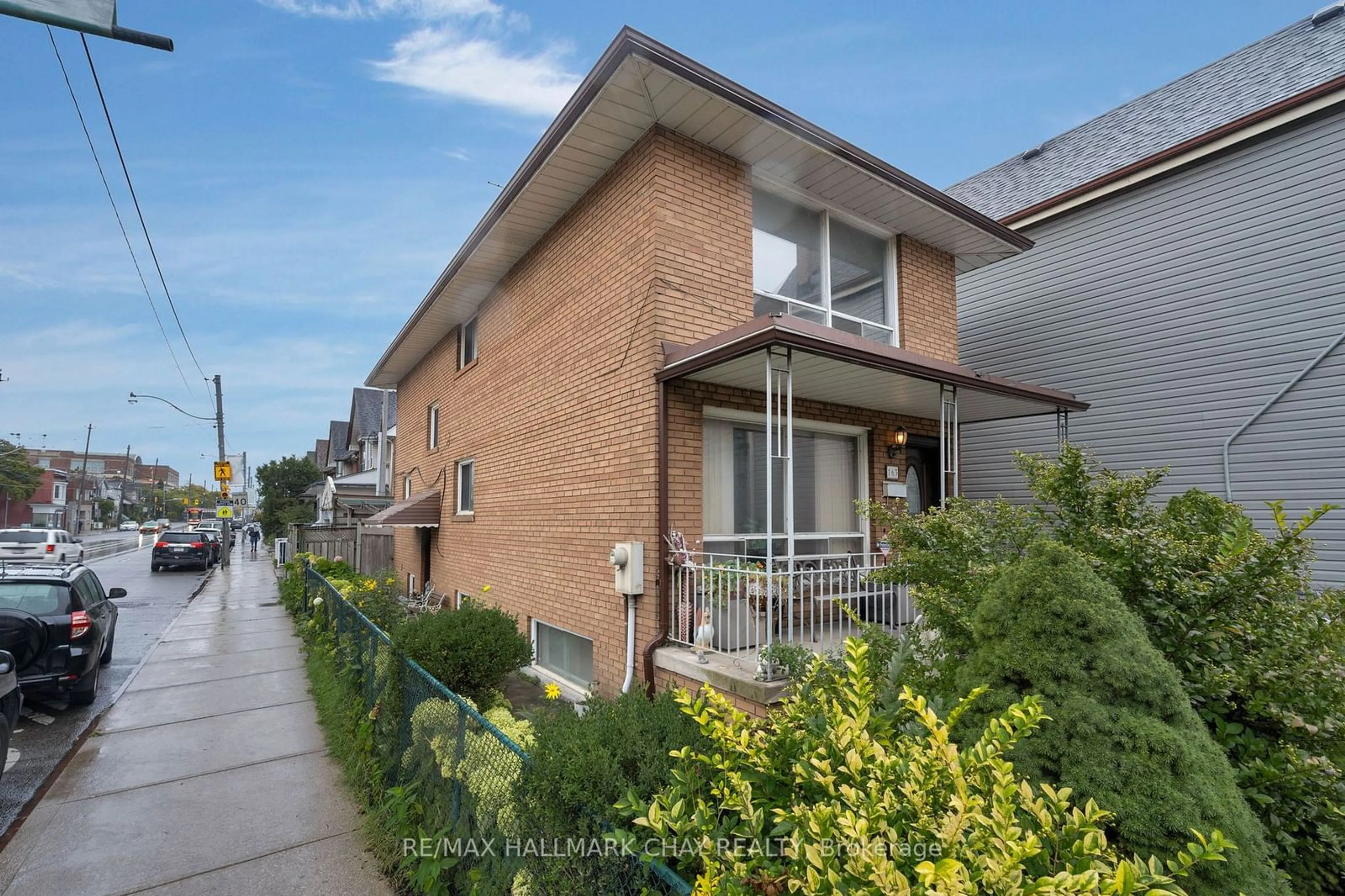 A pic from exterior of the house or condo, the street view for 163 Saint Clarens Ave, Toronto Ontario M6K 2S9