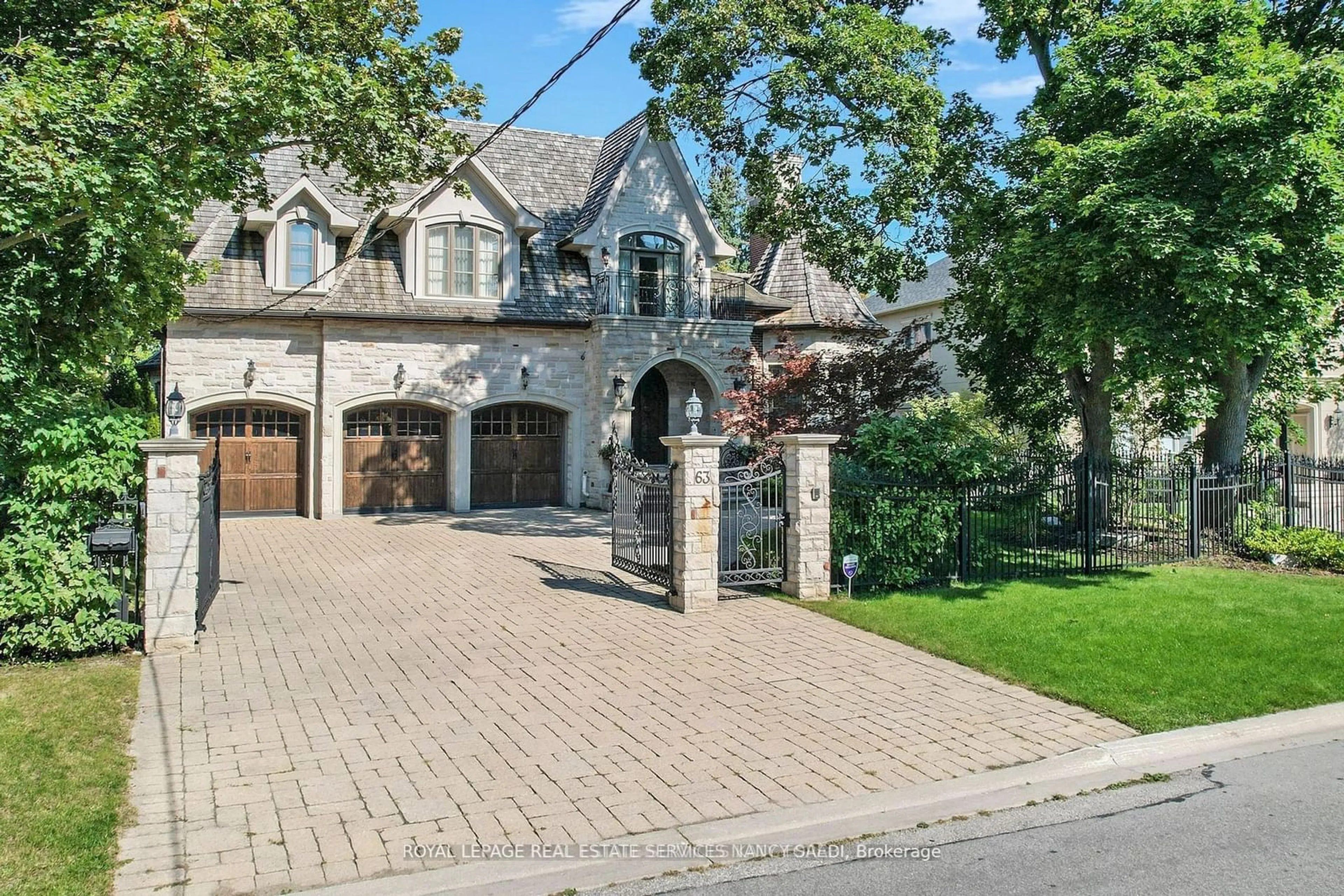 Home with brick exterior material for 63 Rollscourt Dr, Toronto Ontario M2L 1Y1