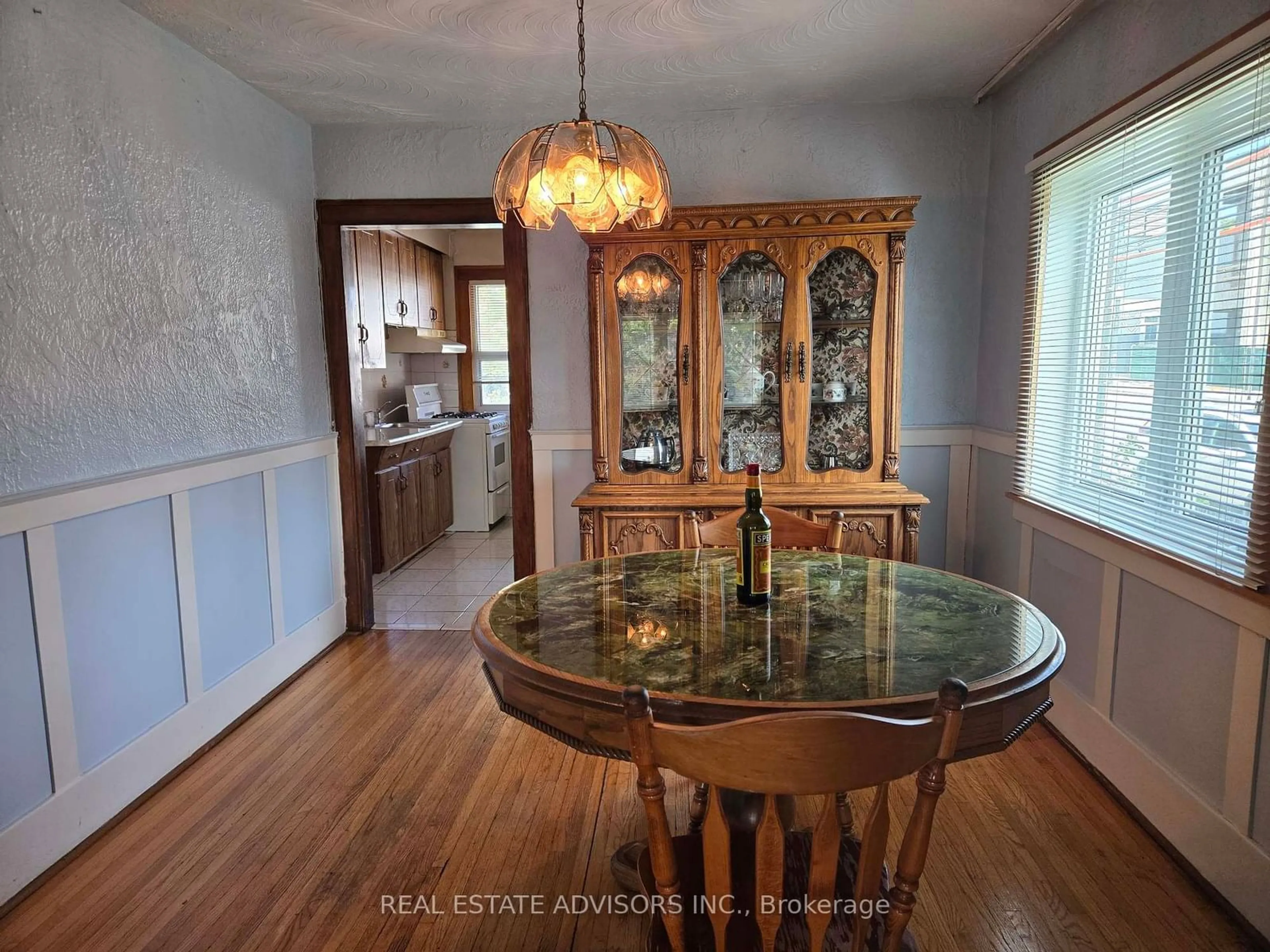 Dining room, wood/laminate floor for 2 Ashbury Ave, Toronto Ontario M6E 1V7