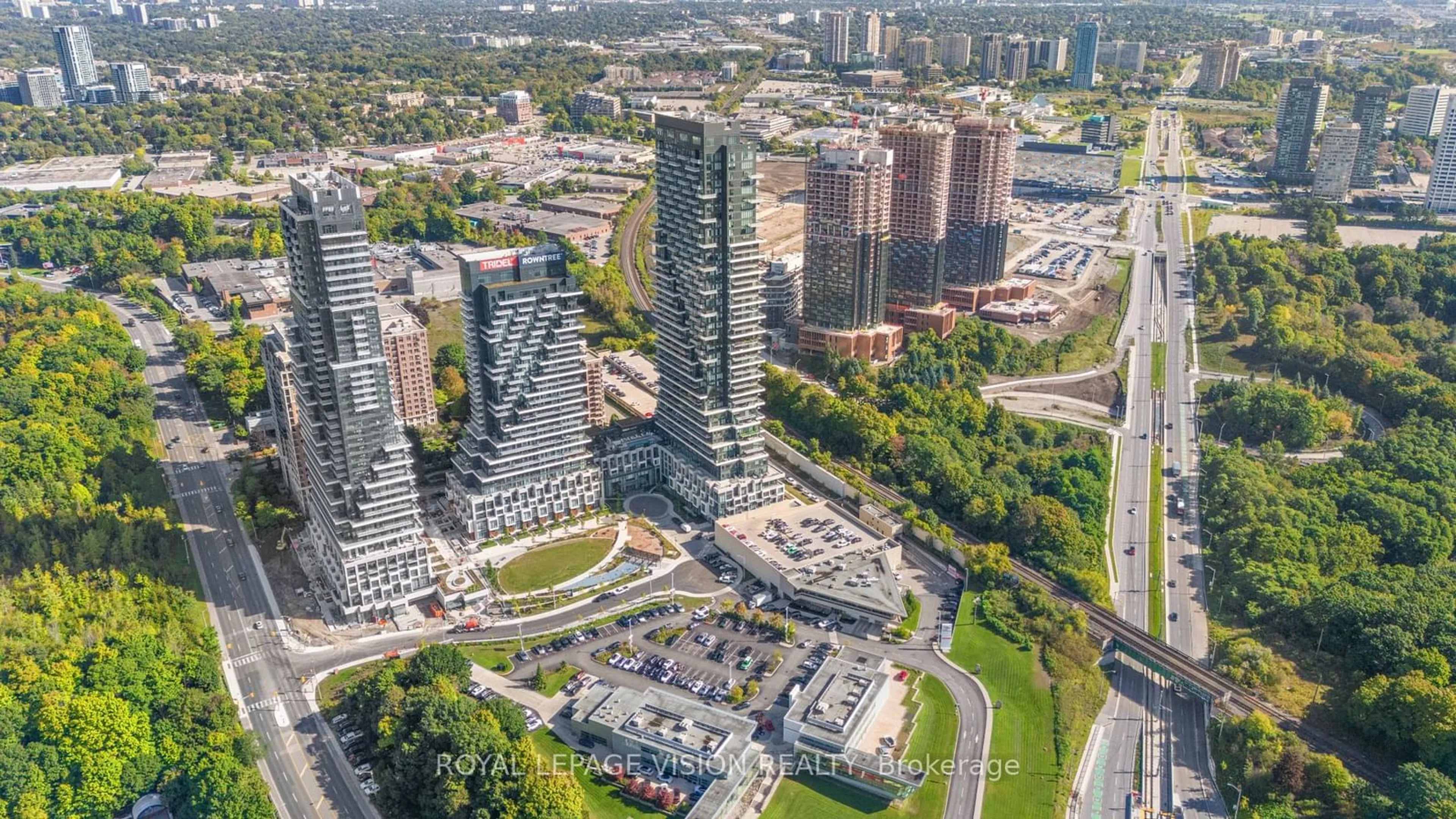 A pic from exterior of the house or condo, the view of city buildings for 30 Inn on the Park Dr #1202, Toronto Ontario M3C 0P7