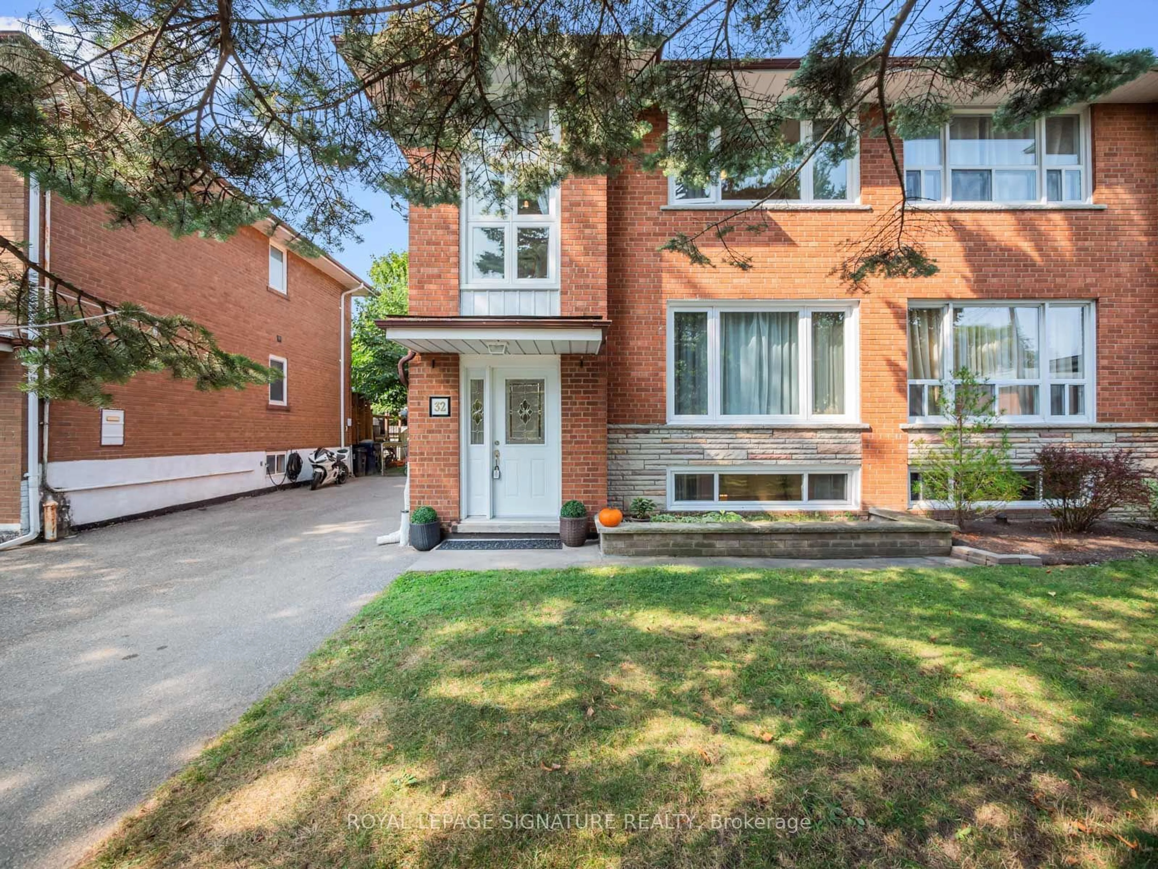 Home with brick exterior material for 32 Daleside Cres, Toronto Ontario M4A 2H6