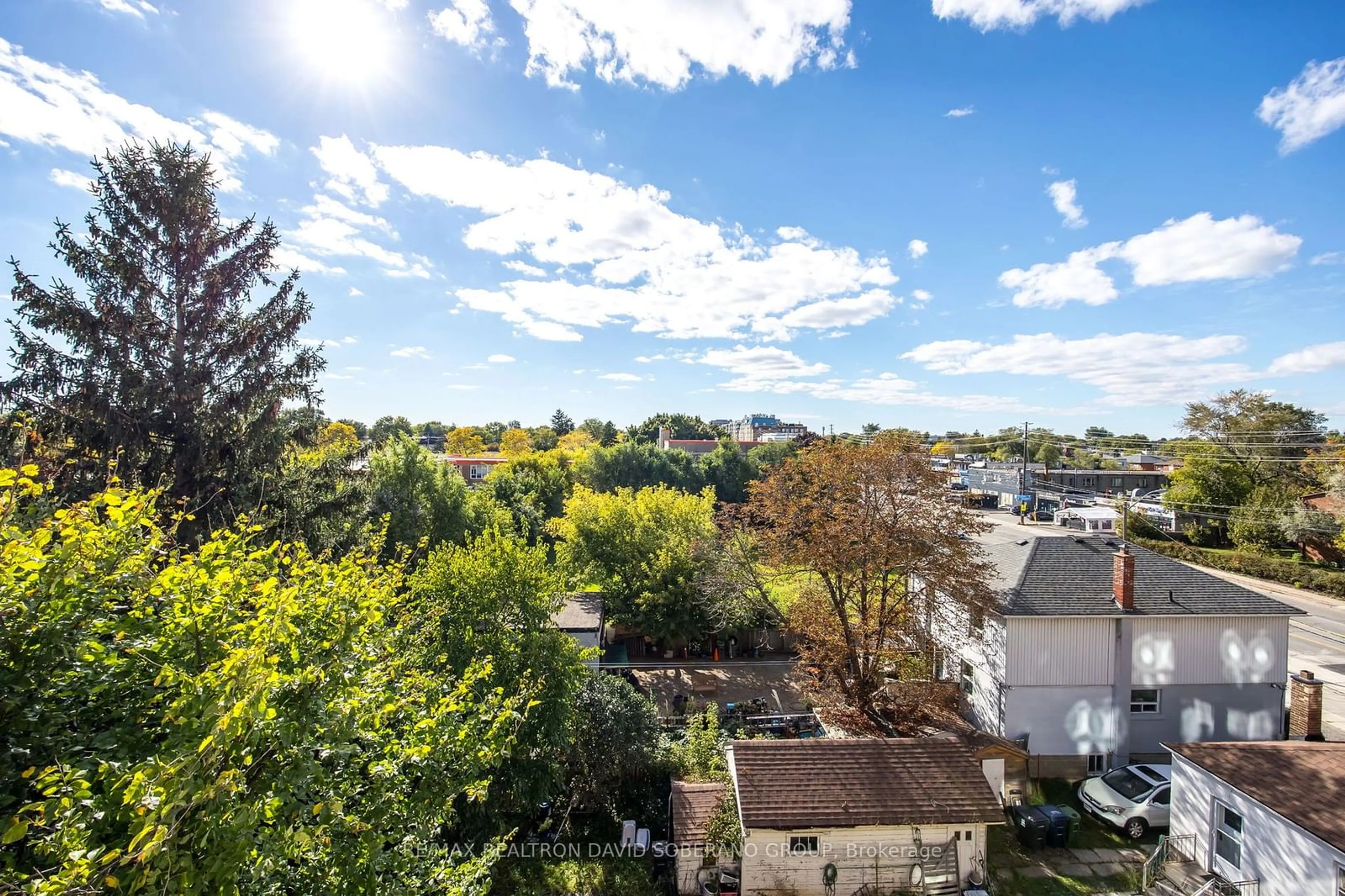 A pic from exterior of the house or condo, the fenced backyard for 801 Sheppard Ave #608, Toronto Ontario M3H 0A8