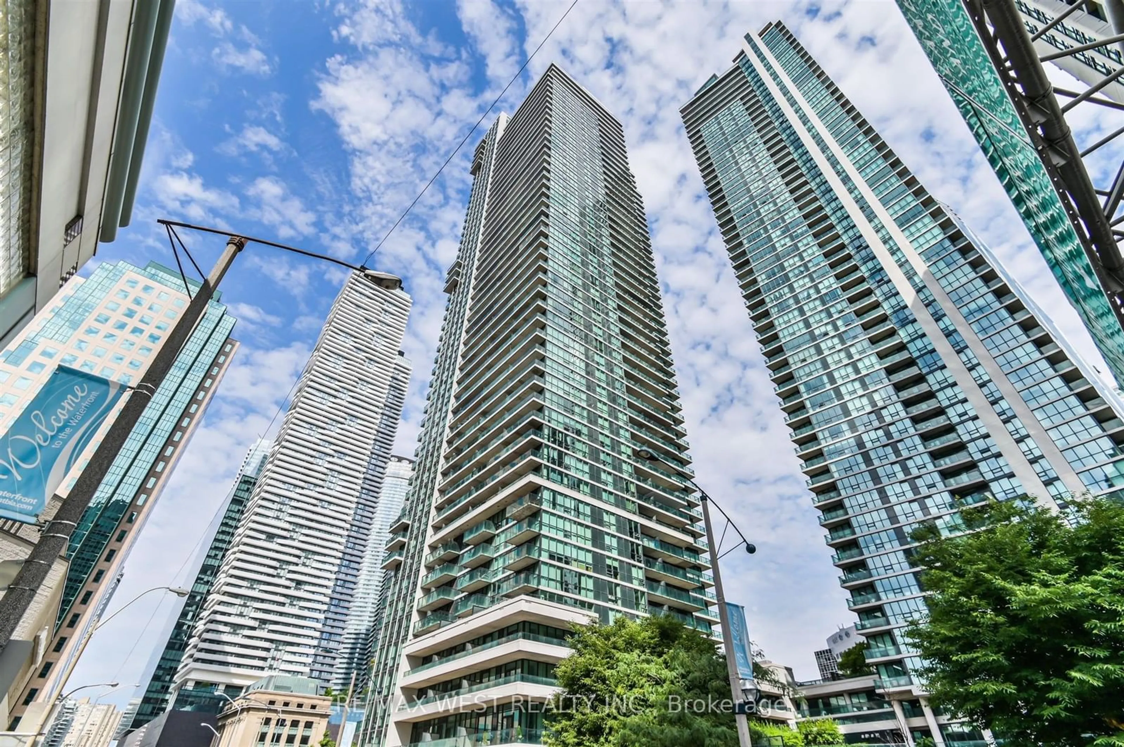 A pic from exterior of the house or condo, the view of city buildings for 33 Bay St #903, Toronto Ontario M5J 2Z3