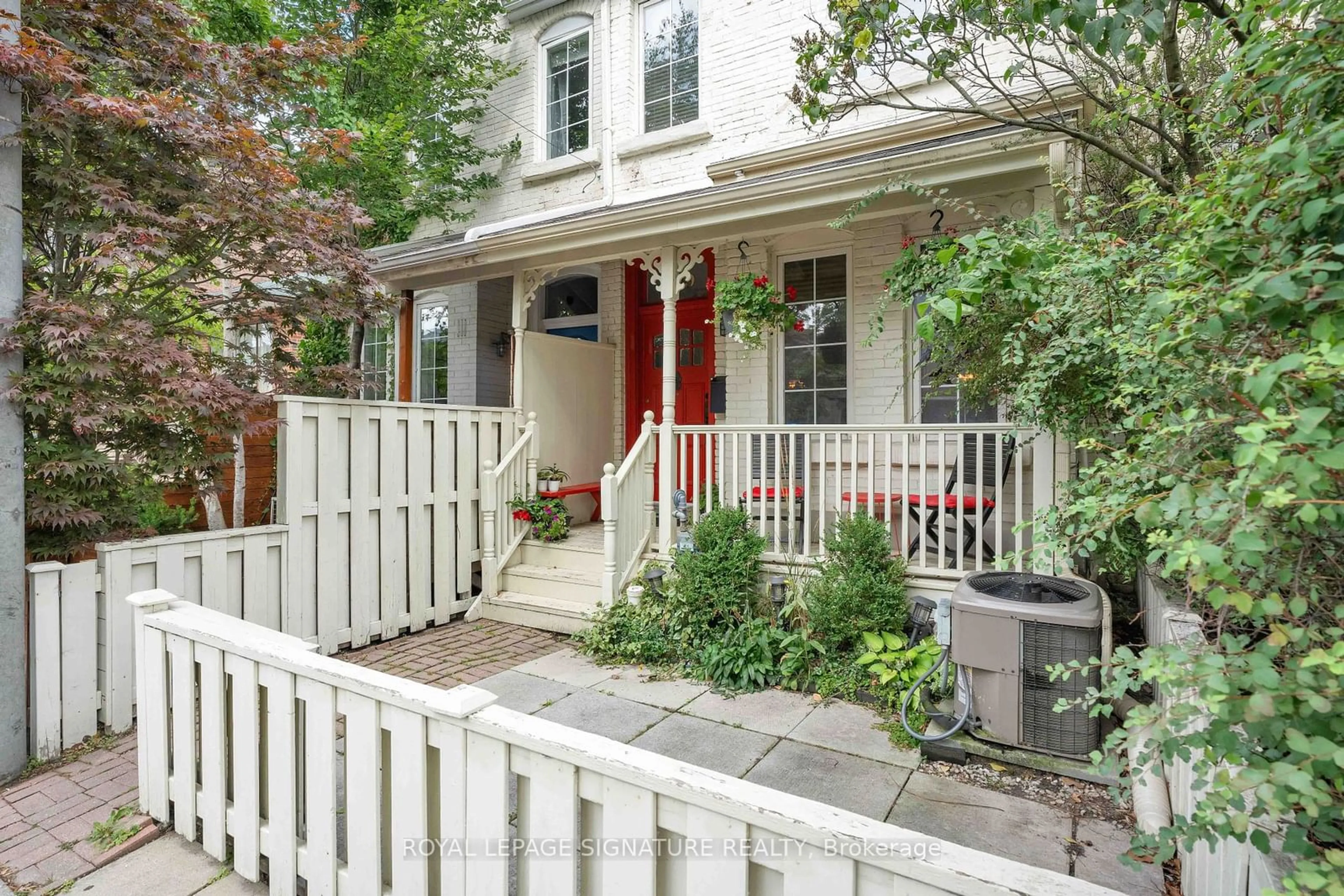 A pic from exterior of the house or condo, the fenced backyard for 109 Manning Ave, Toronto Ontario M6J 2K6