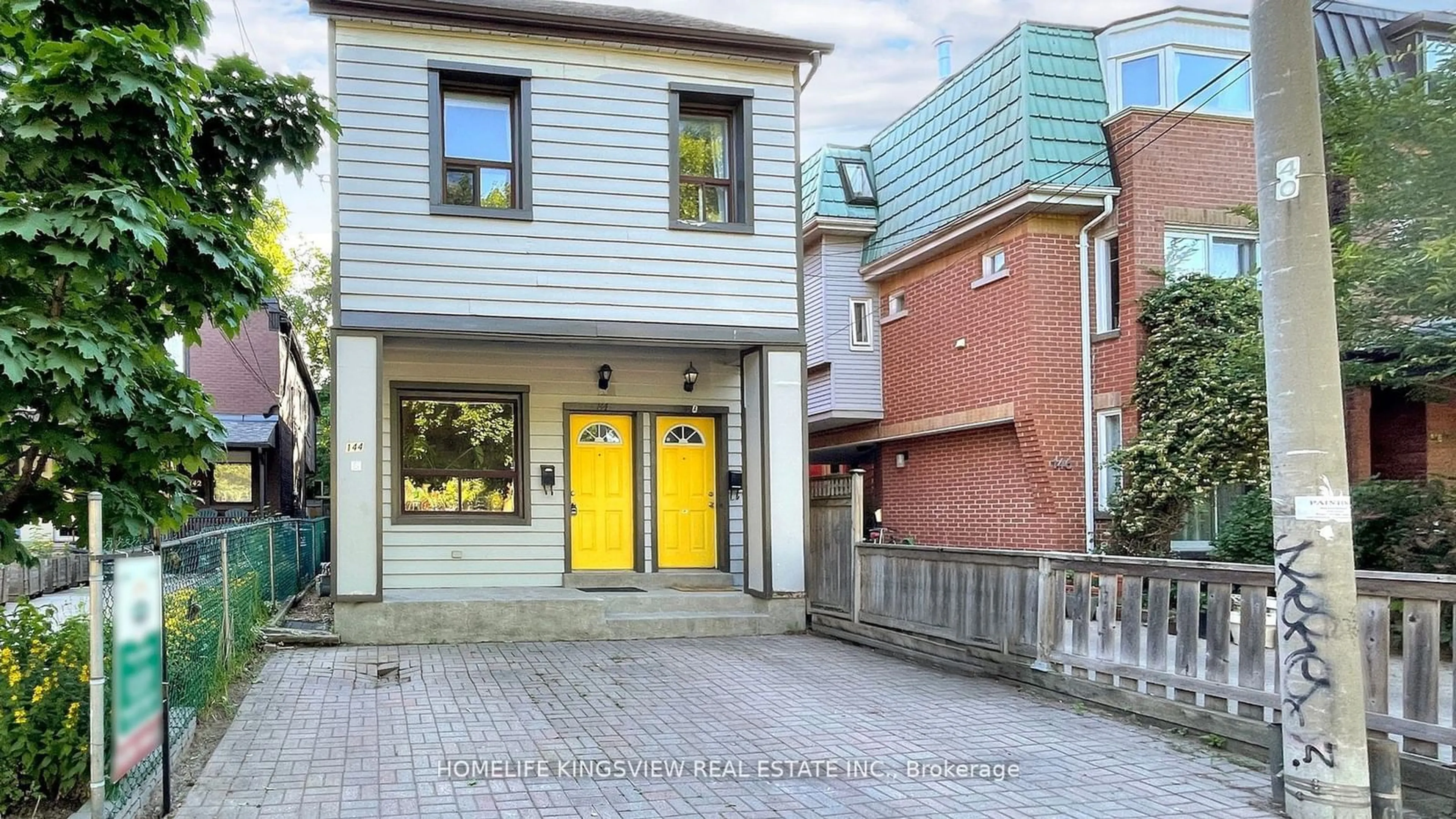 A pic from exterior of the house or condo, the street view for 144 Clinton St, Toronto Ontario M6G 2Y3