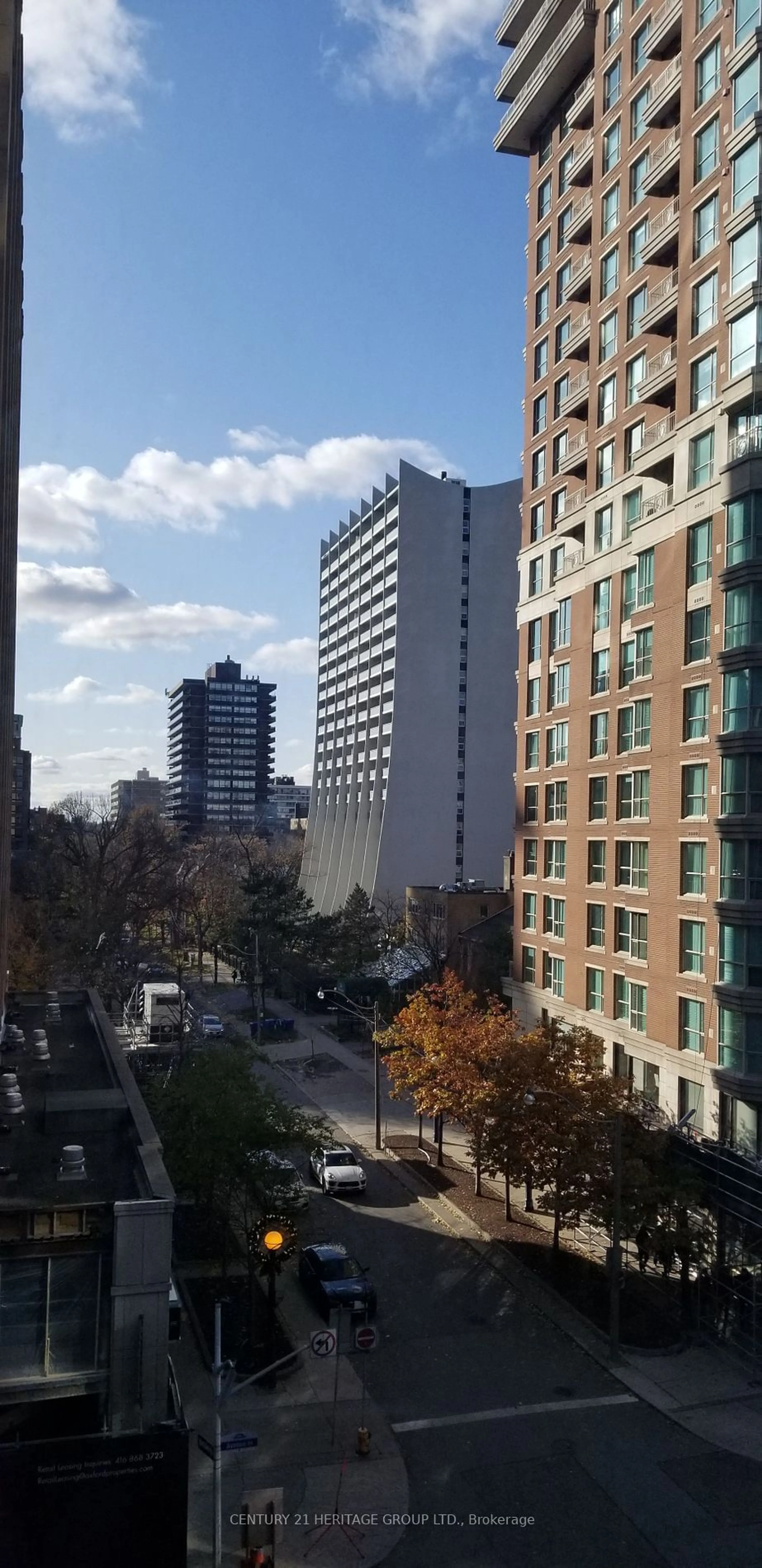 A pic from exterior of the house or condo, the view of city buildings for 188 Cumberland St #411, Toronto Ontario M5R 0B6