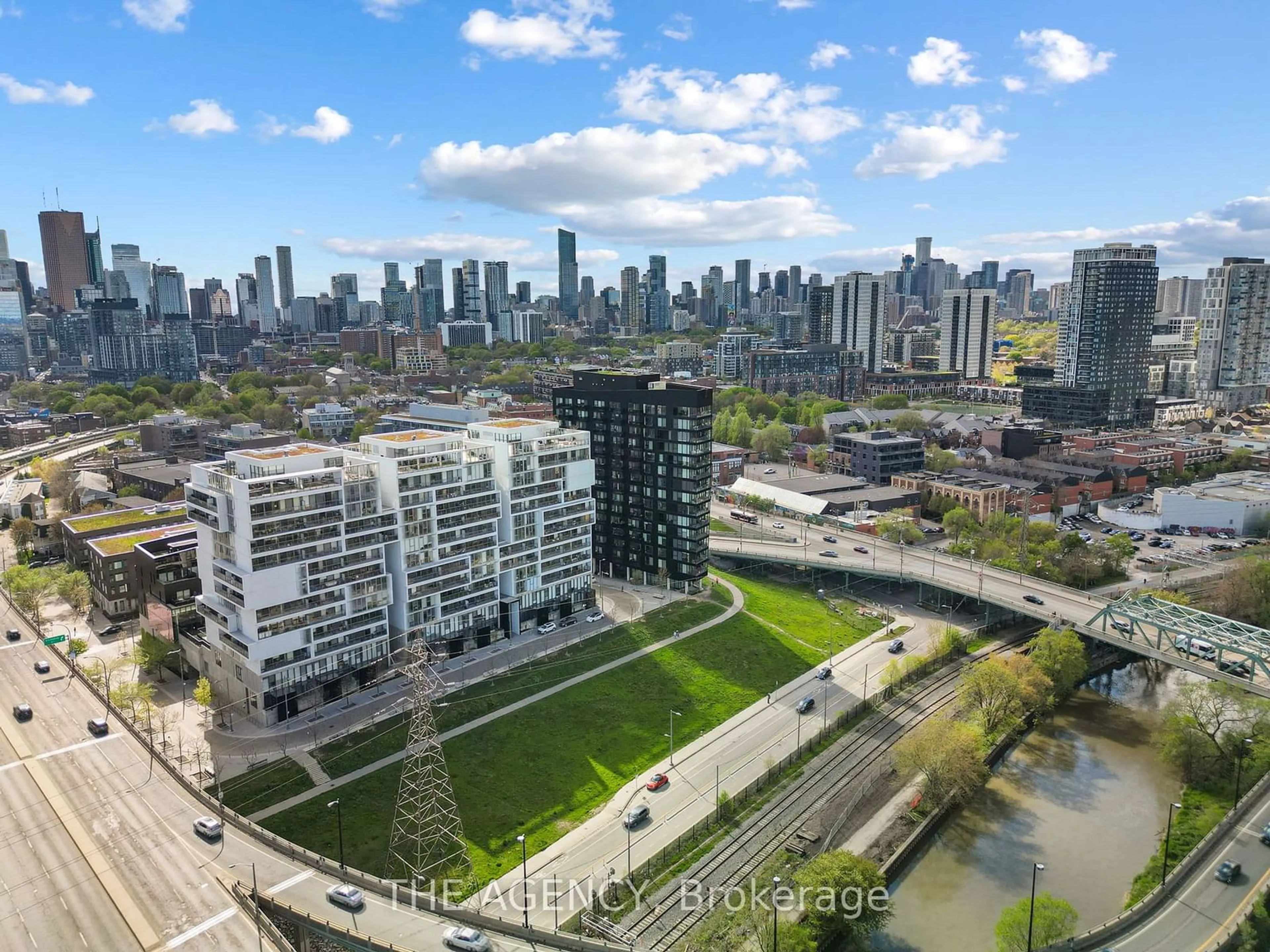 A pic from exterior of the house or condo, the view of city buildings for 51 Trolley Cres #624, Toronto Ontario M5A 0E9