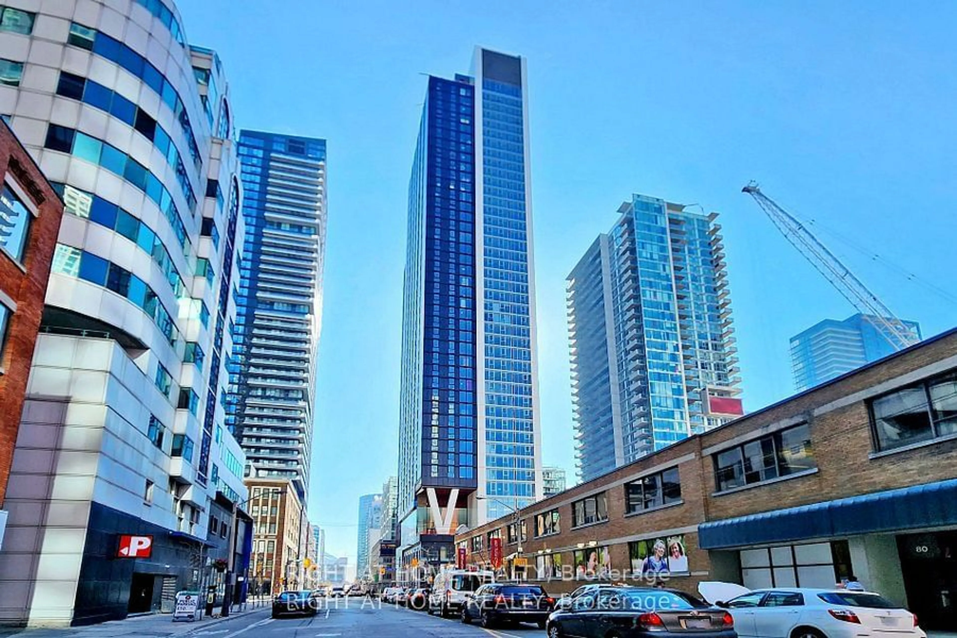 A pic from exterior of the house or condo, the view of city buildings for 357 King St #603, Toronto Ontario M5V 0S7