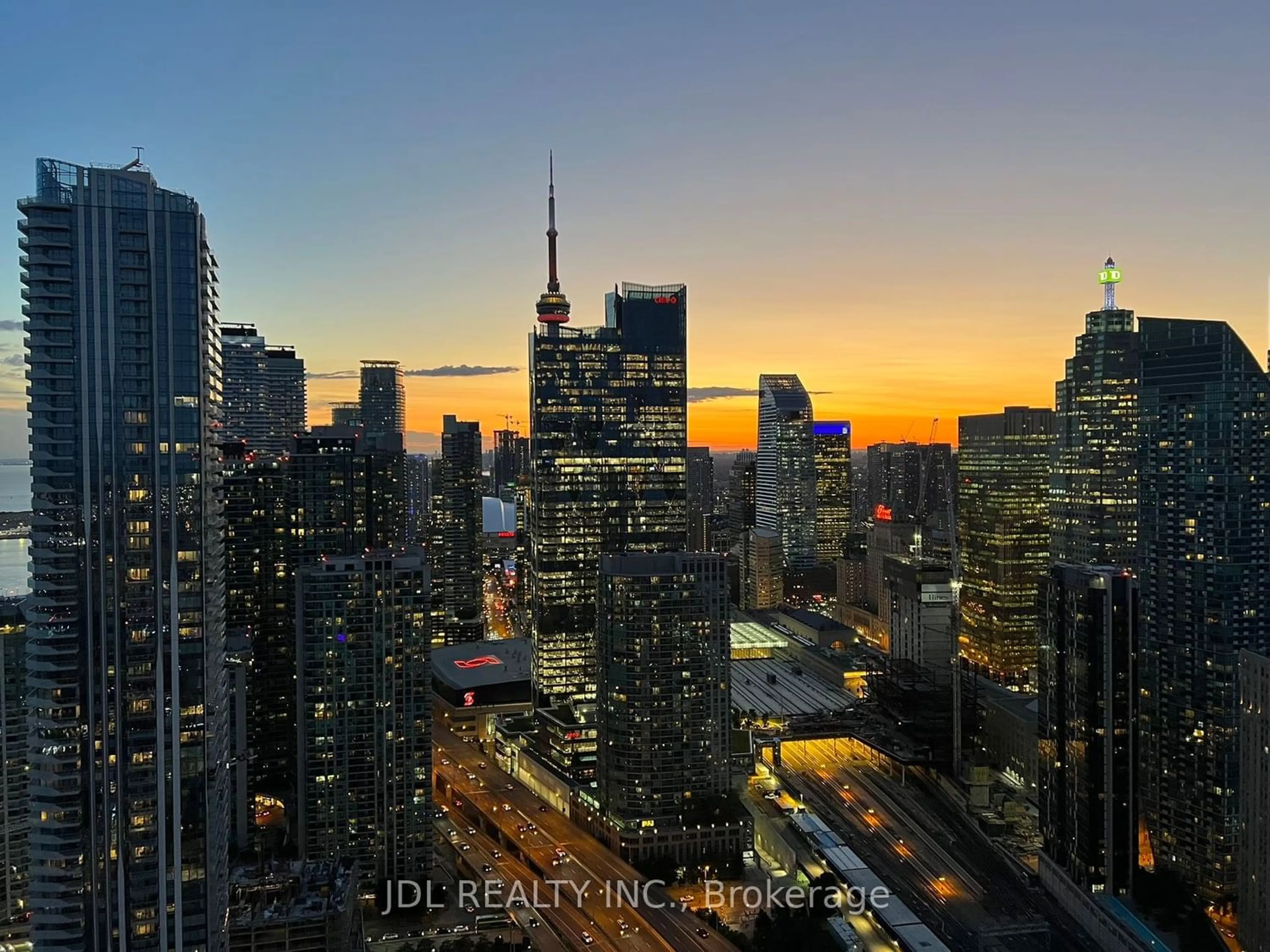 A pic from exterior of the house or condo, the view of city buildings for 55 Cooper St #5811, Toronto Ontario M5E 0G1