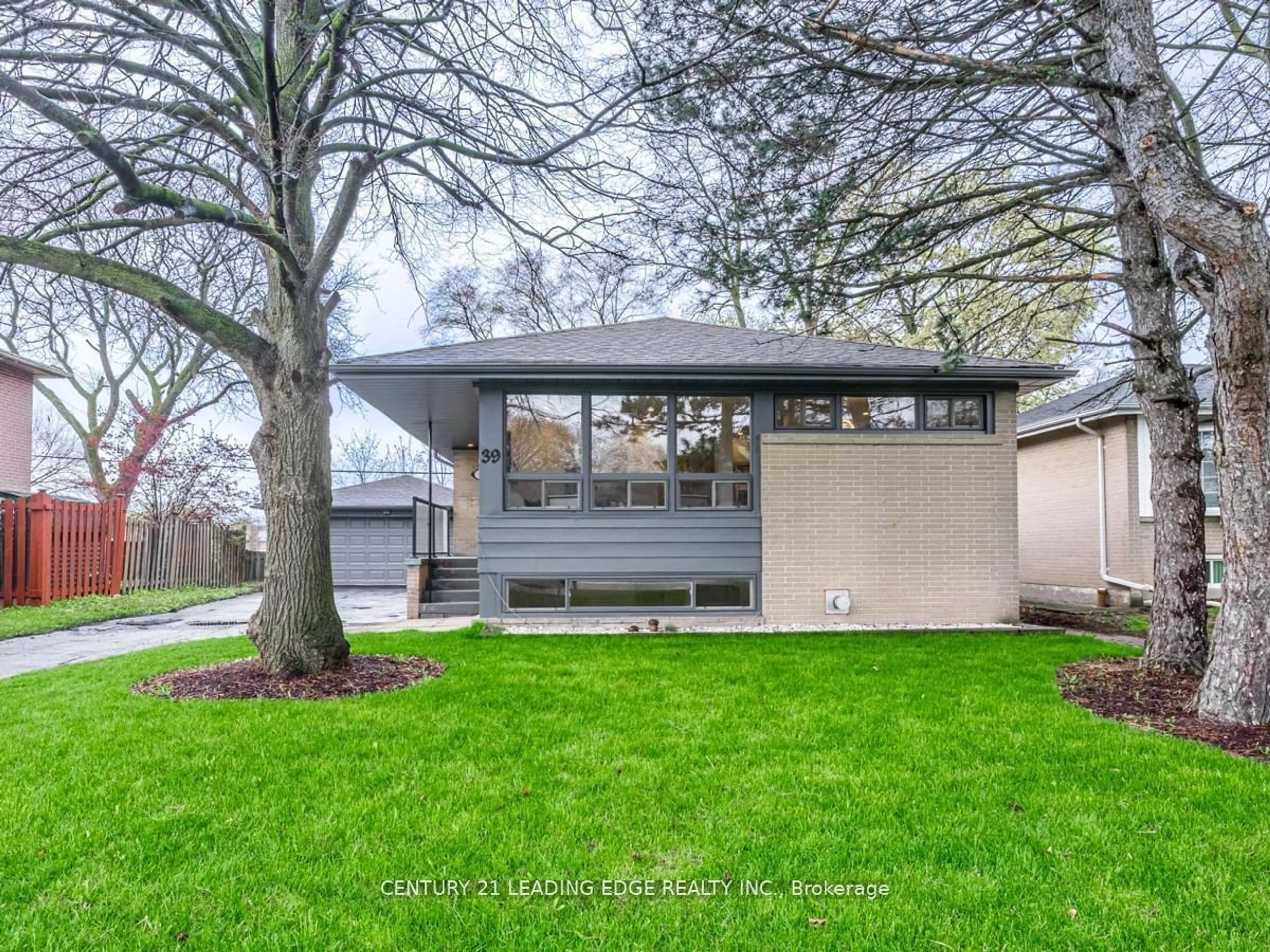 Frontside or backside of a home, the fenced backyard for 39 TREADGOLD Cres, Toronto Ontario M3A 1X1