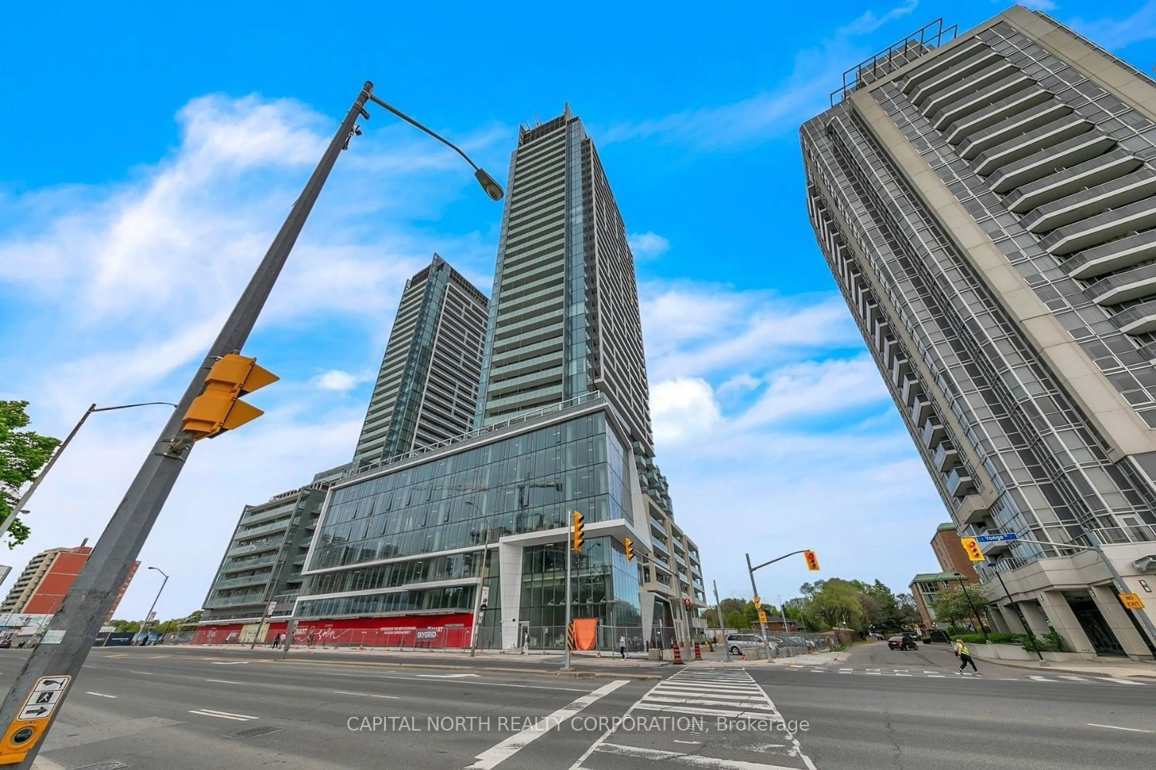 A pic from exterior of the house or condo, the street view for 8 Olympic Garden Dr #1006, Toronto Ontario M2M 0B9