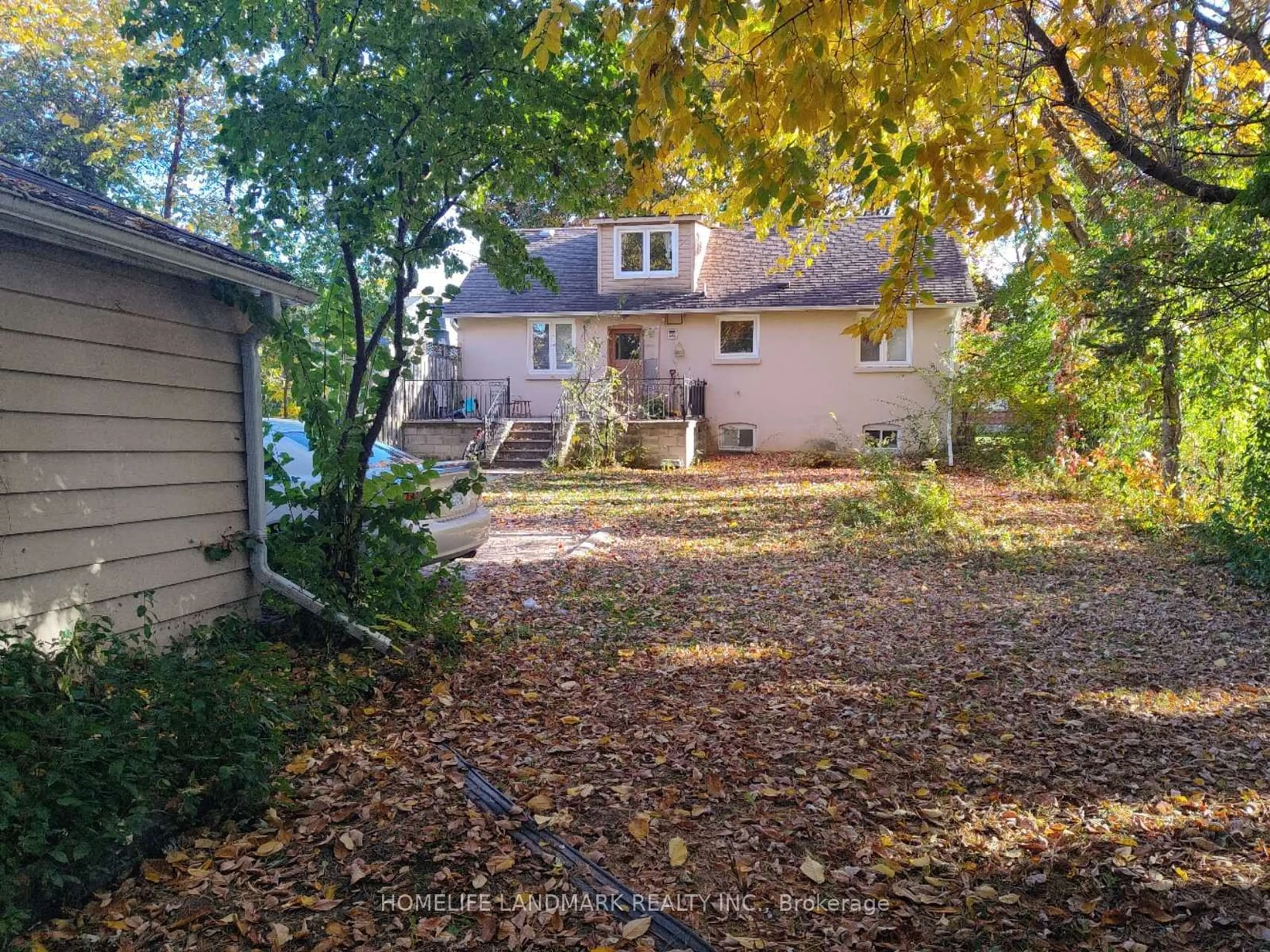 Frontside or backside of a home, the fenced backyard for 90 Elmwood Ave, Toronto Ontario M2N 3L9