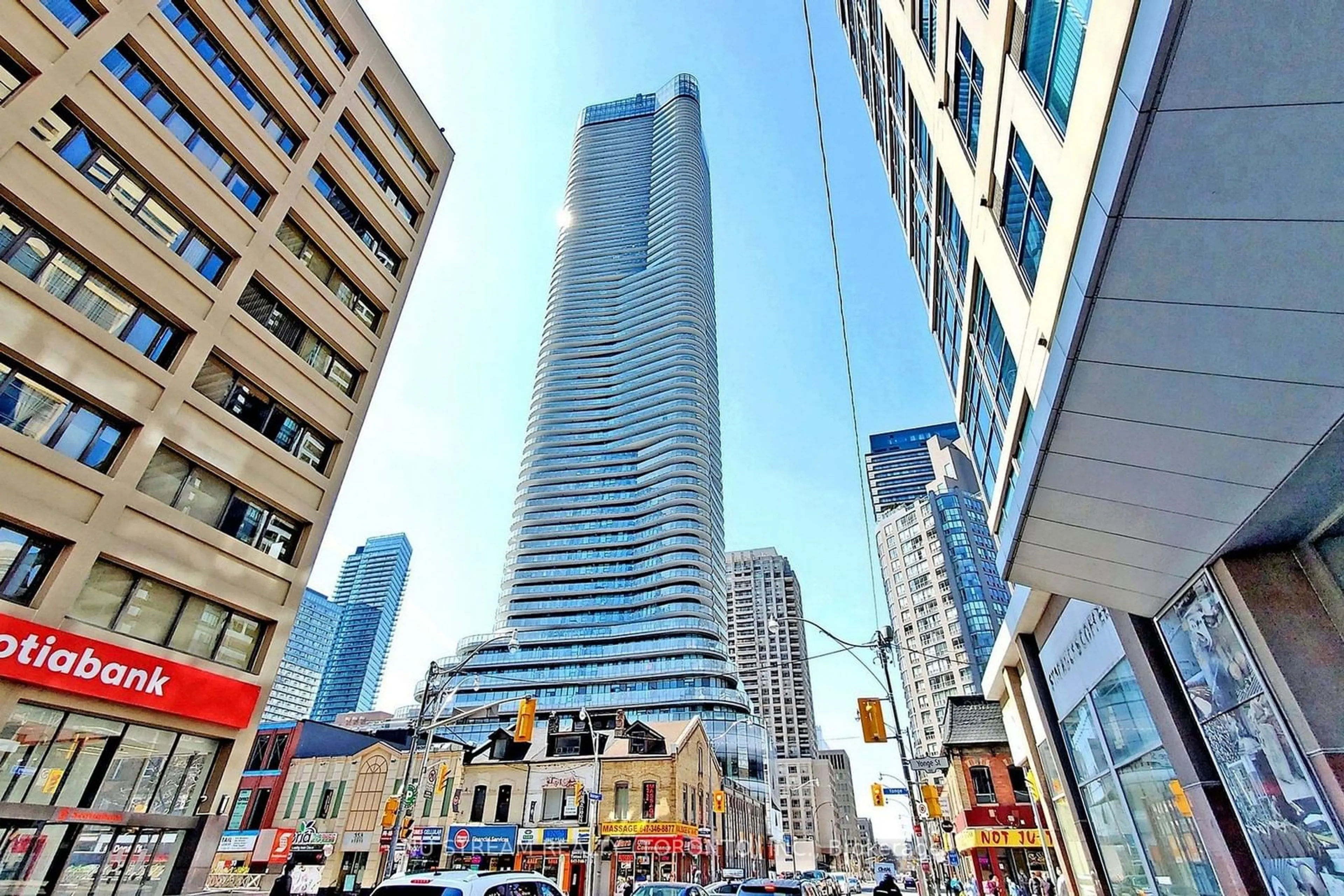 A pic from exterior of the house or condo, the street view for 11 Wellesley St #5704, Toronto Ontario M4Y 0G4