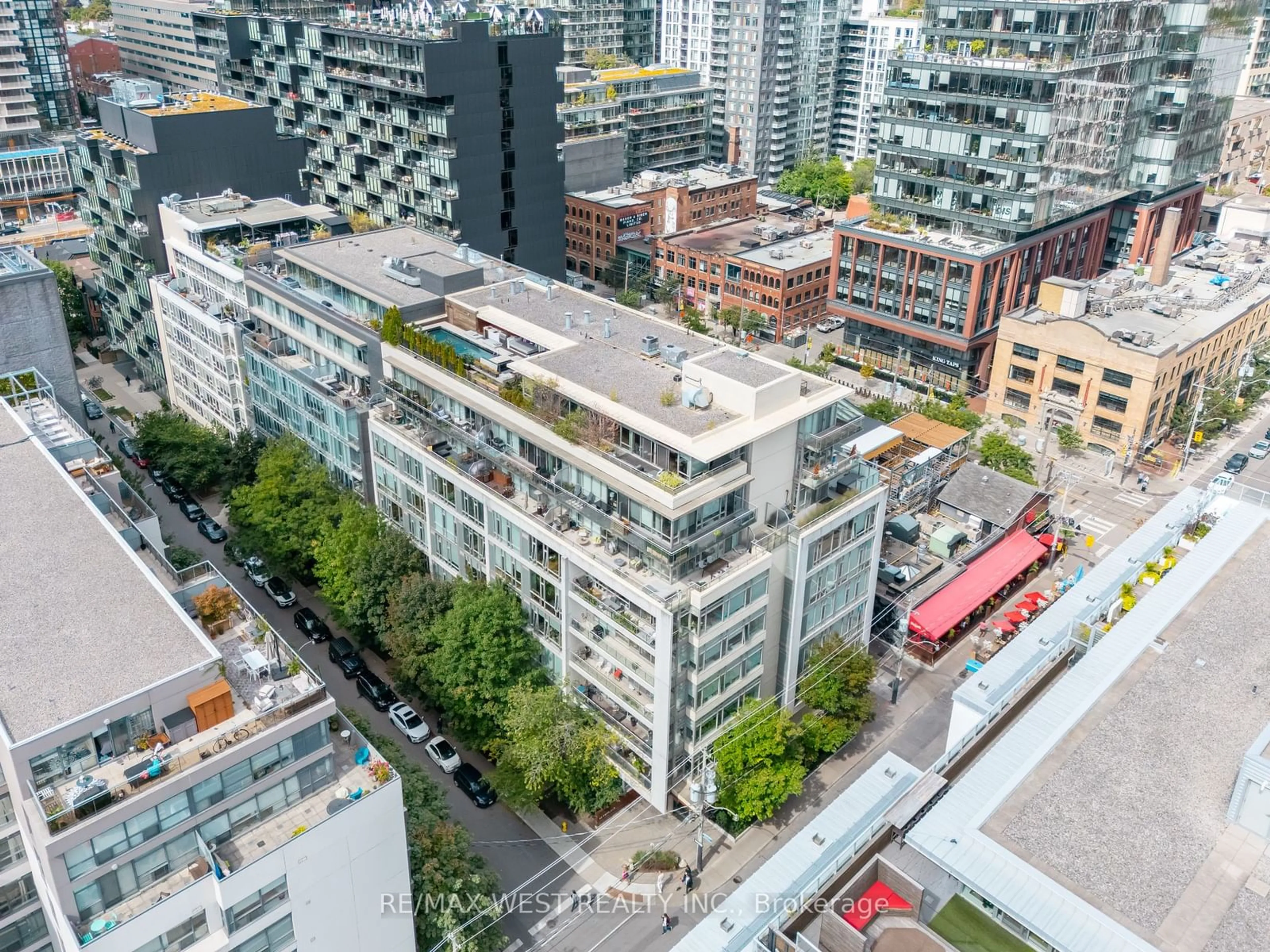 A pic from exterior of the house or condo, the view of city buildings for 66 Portland St #212, Toronto Ontario M5V 2M6