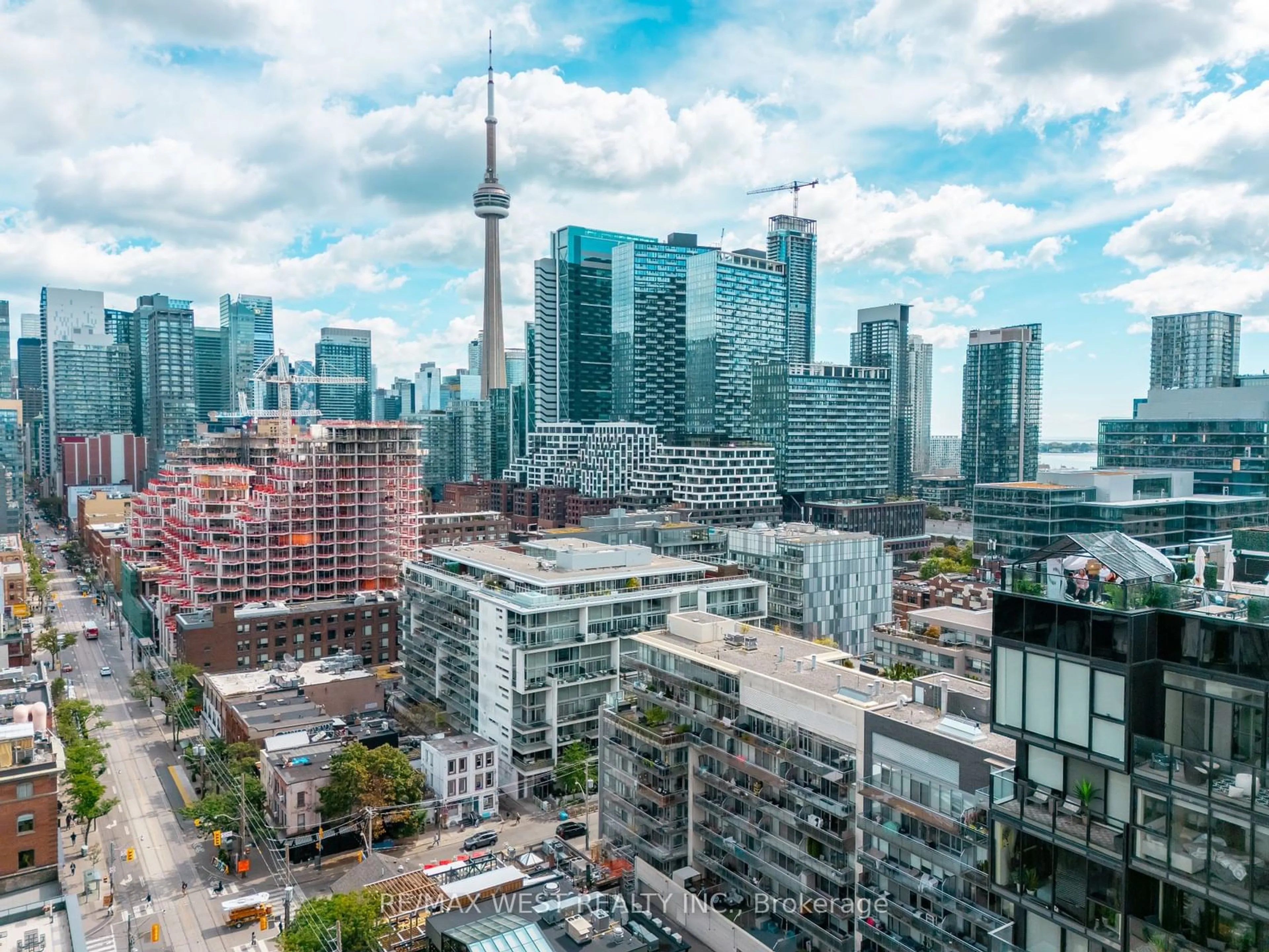 A pic from exterior of the house or condo, the view of city buildings for 66 Portland St #212, Toronto Ontario M5V 2M6