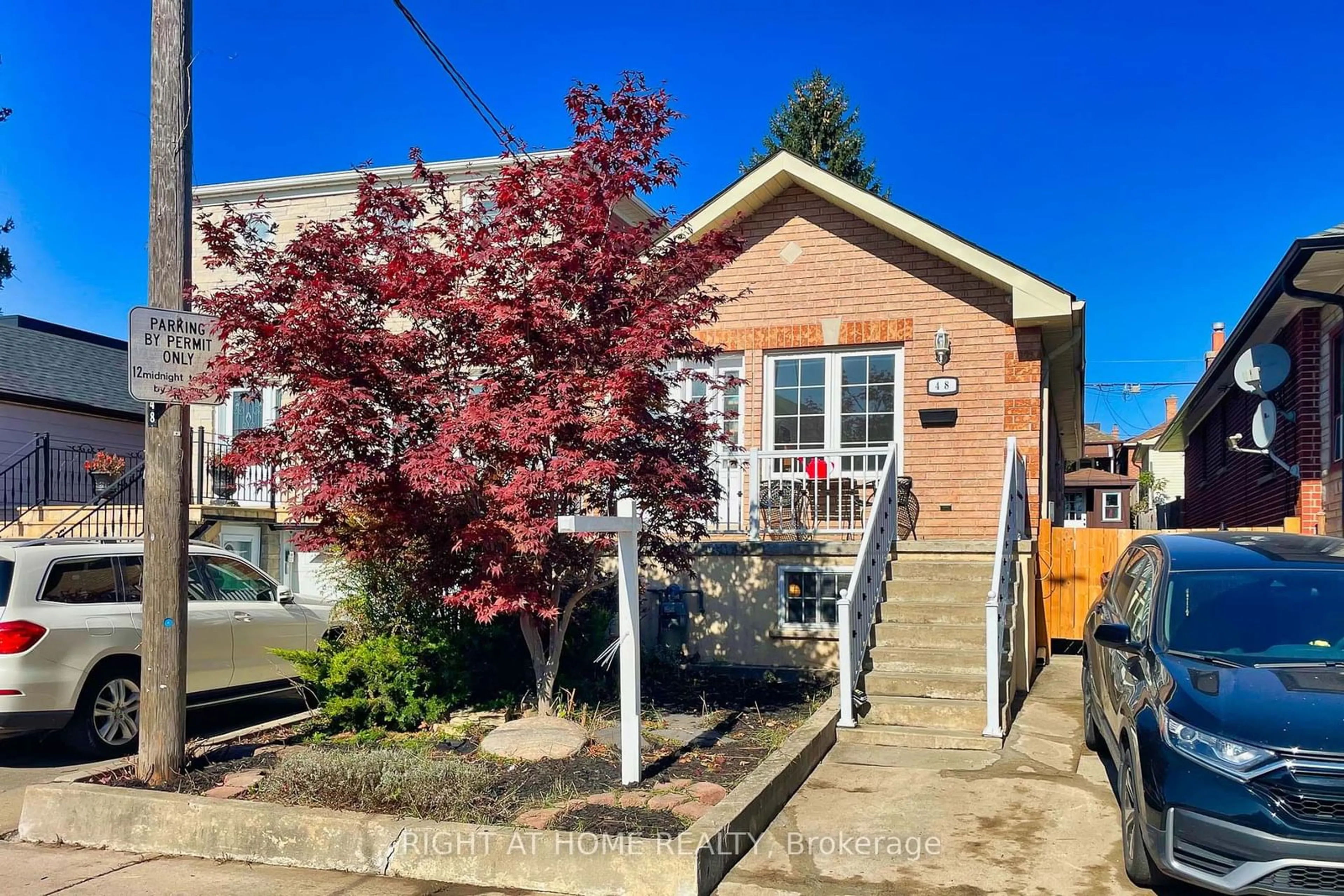 A pic from exterior of the house or condo, the fenced backyard for 48 Hanson Rd, Toronto Ontario M6E 1T3