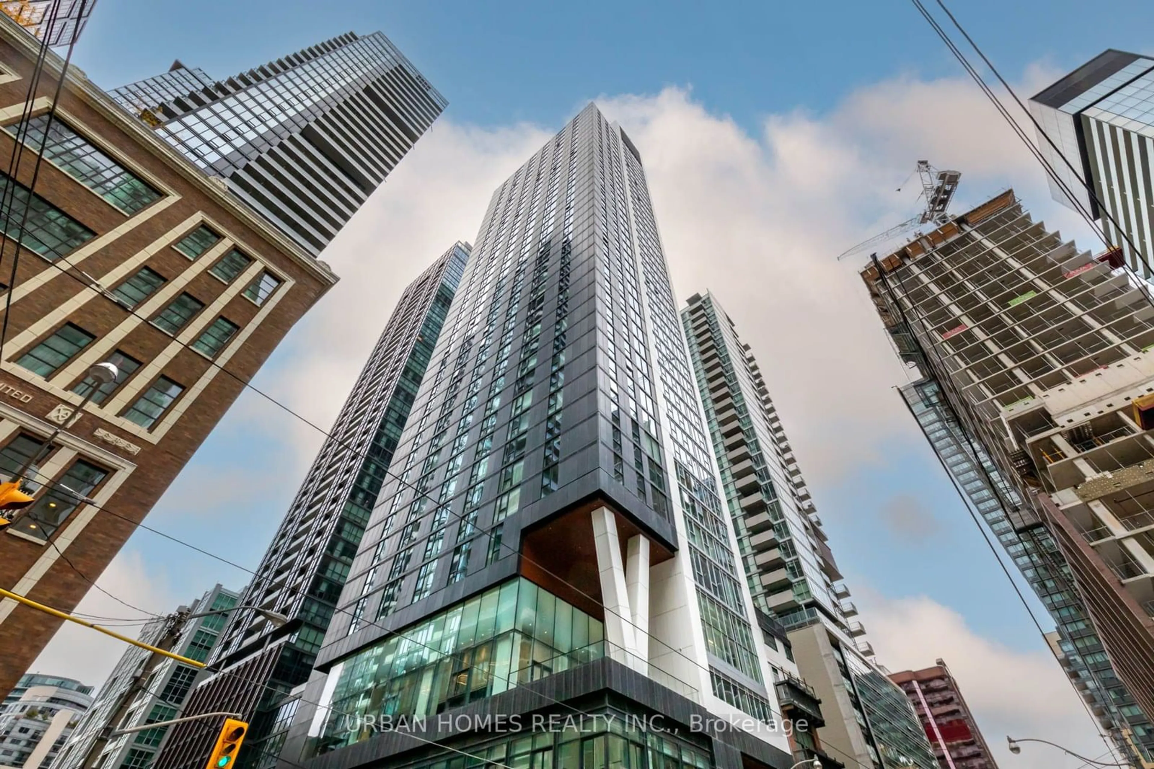 A pic from exterior of the house or condo, the view of city buildings for 357 King St #608, Toronto Ontario M5V 0S7