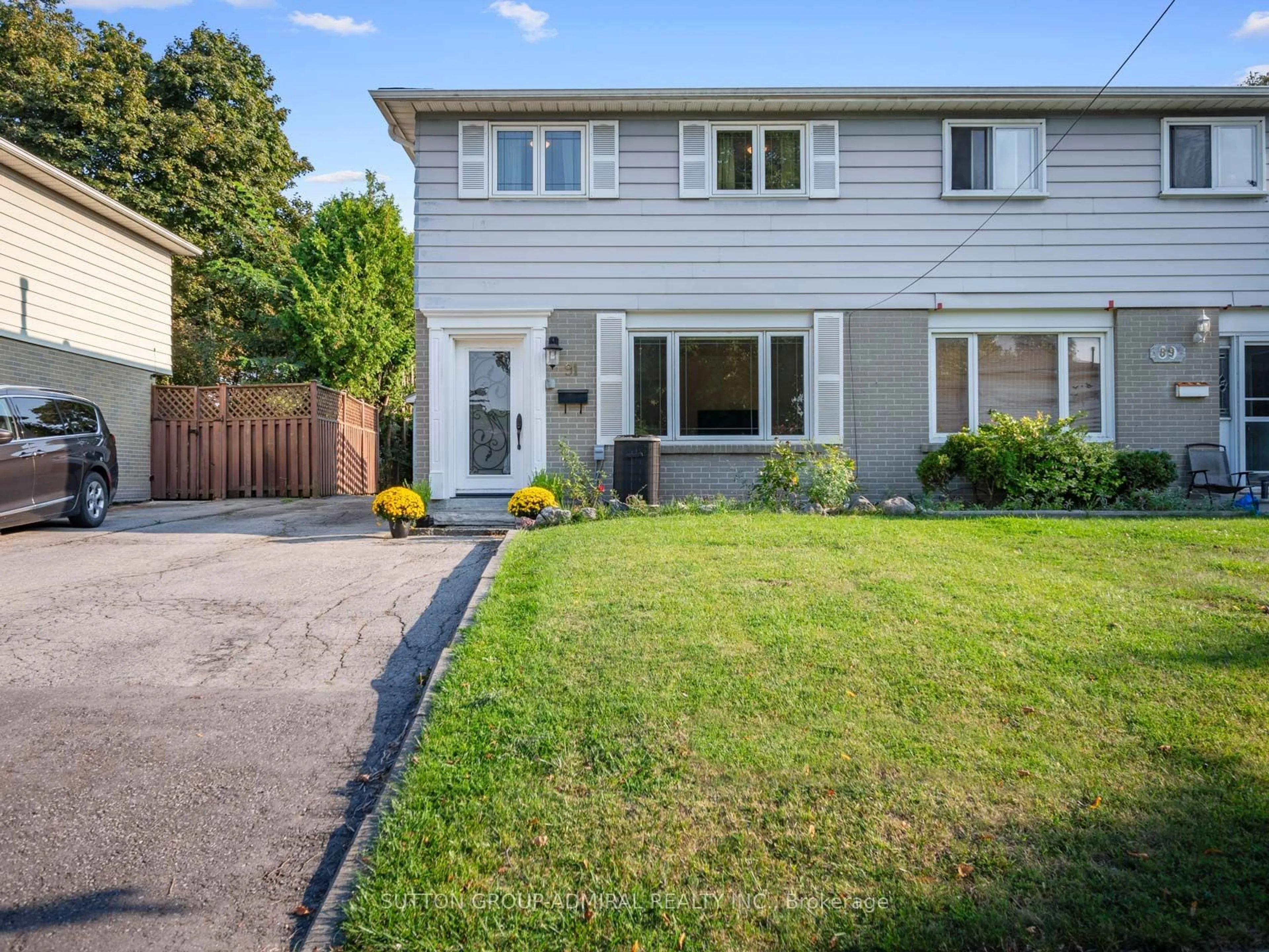 Frontside or backside of a home, the fenced backyard for 91 Hollyberry Tr, Toronto Ontario M2H 2N9