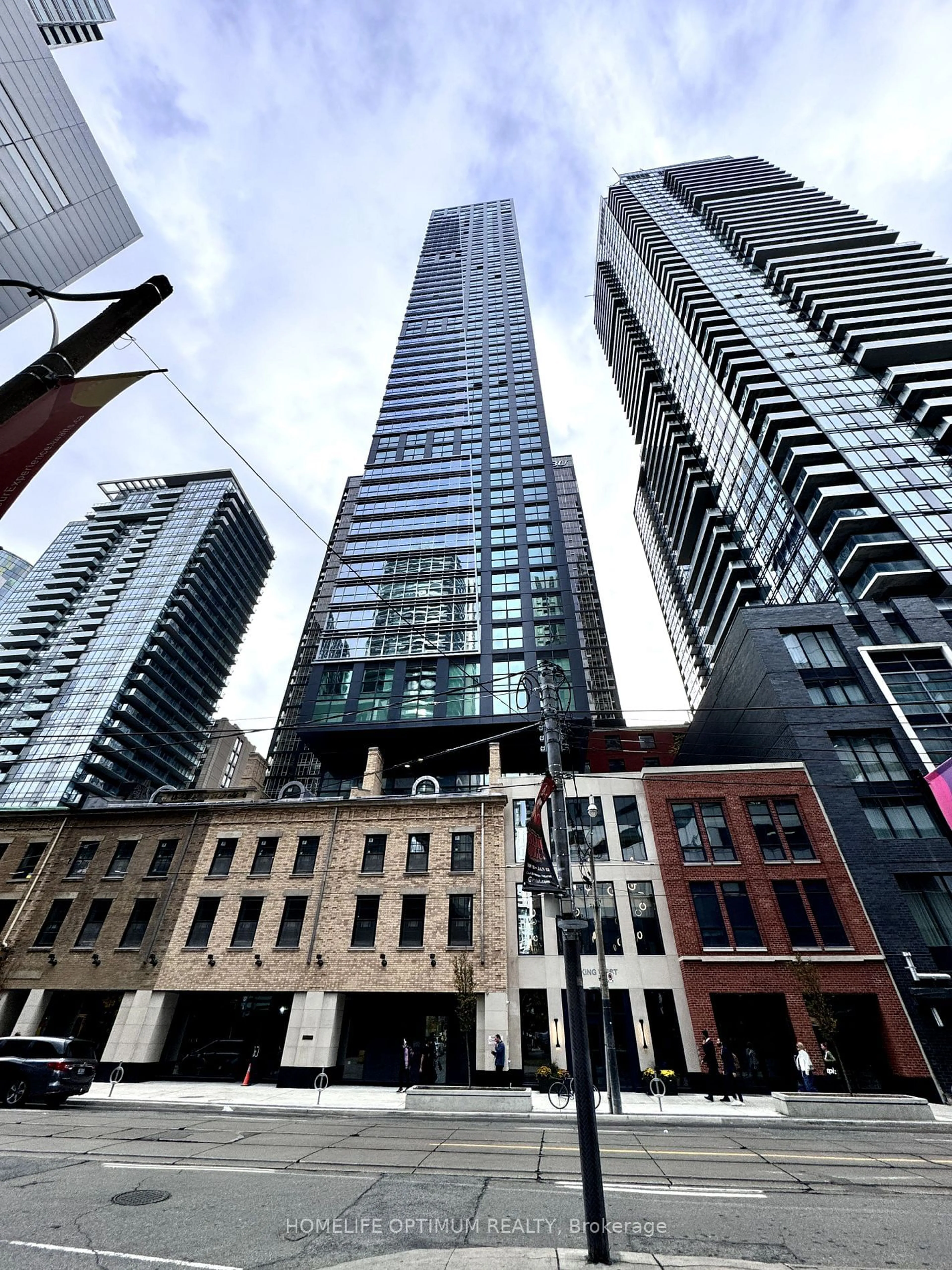 A pic from exterior of the house or condo, the view of city buildings for 327 King St #2301, Toronto Ontario M5V 0W7