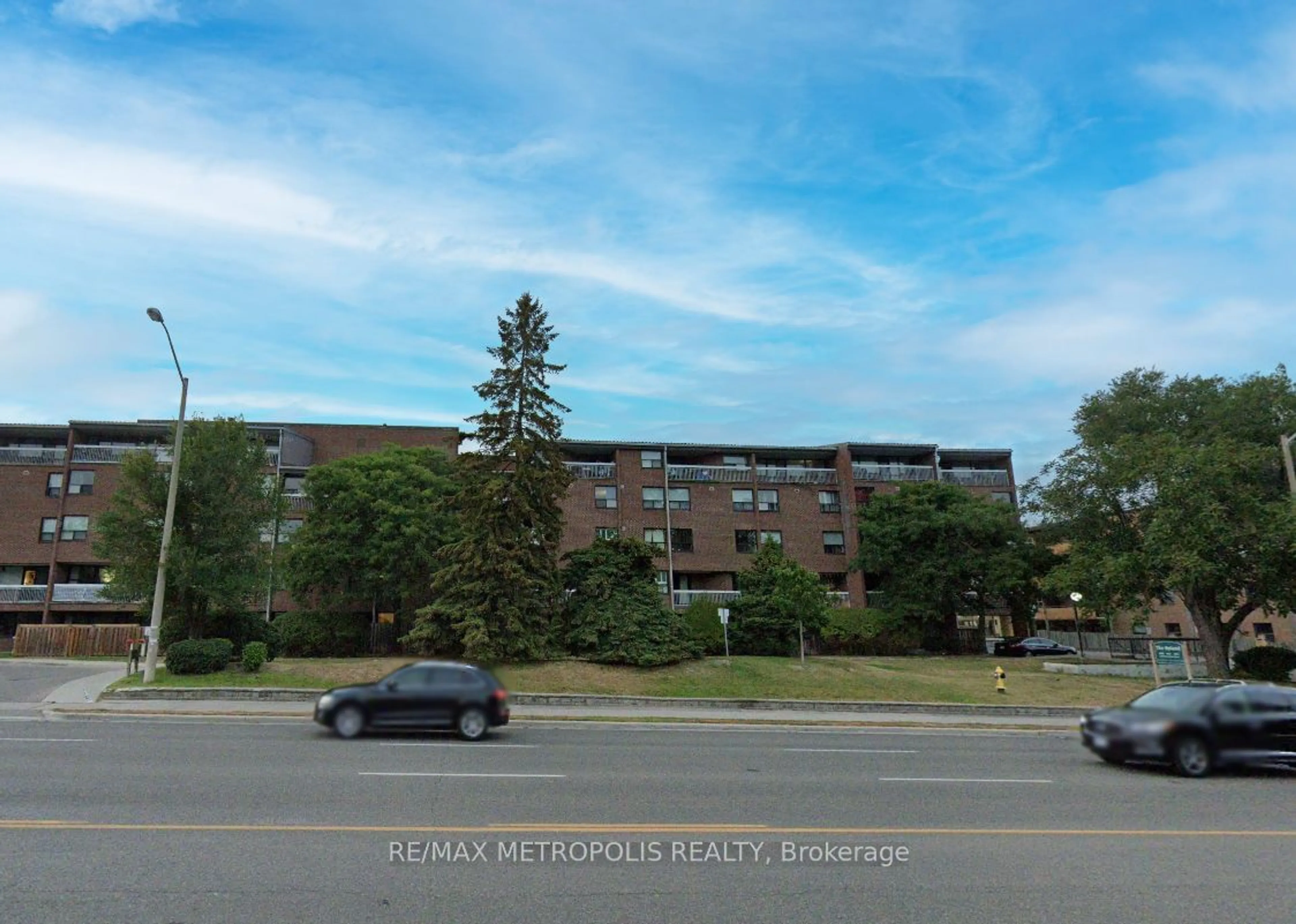 A pic from exterior of the house or condo, the street view for 4060 Lawrence Ave #106, Toronto Ontario M1E 4V4