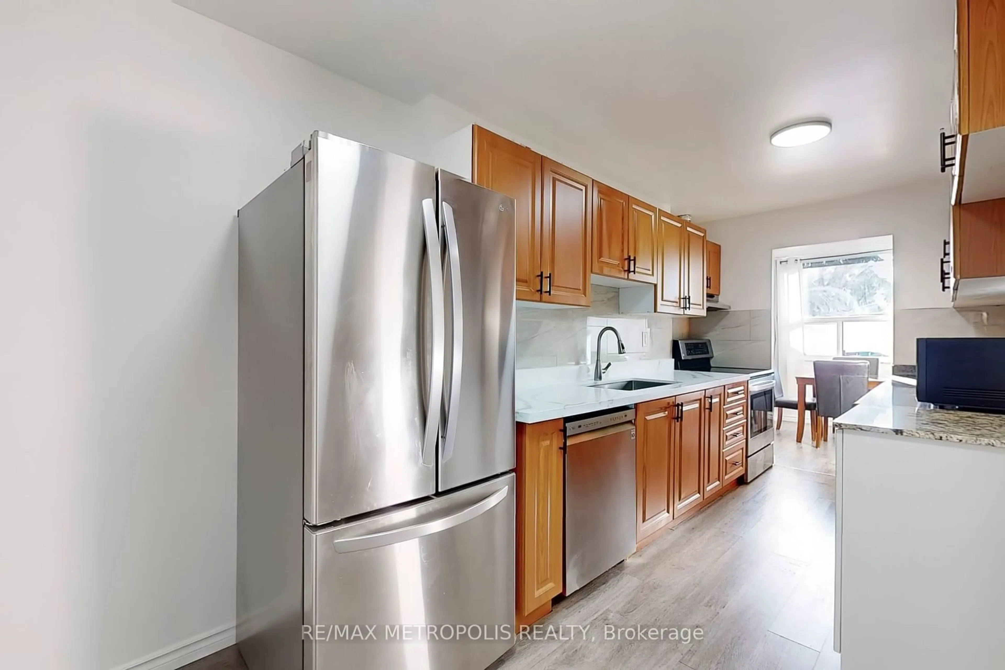 Standard kitchen, wood floors for 4060 Lawrence Ave #106, Toronto Ontario M1E 4V4