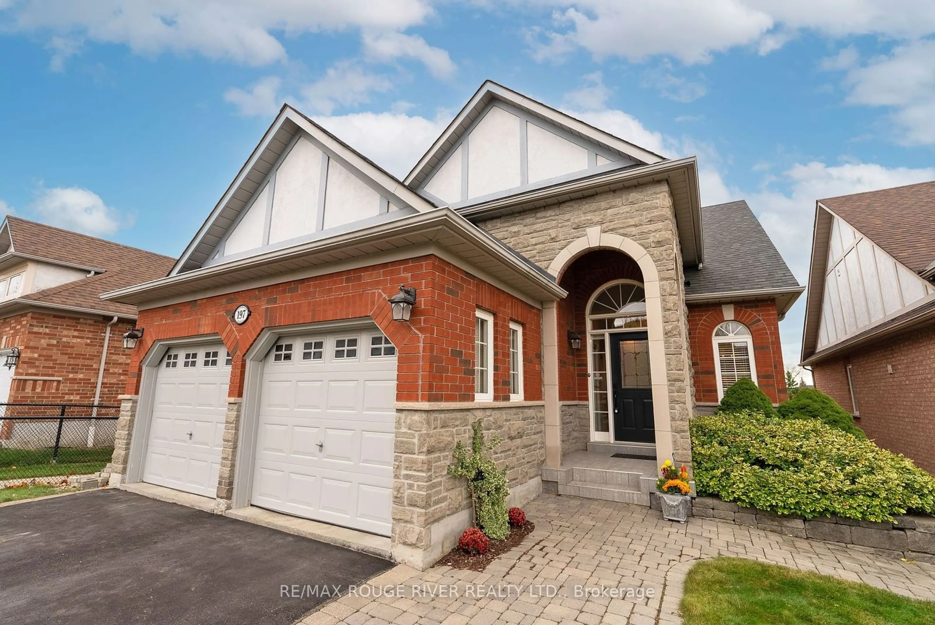 Home with brick exterior material for 197 Stonemanor Ave, Whitby Ontario L1R 2Z1